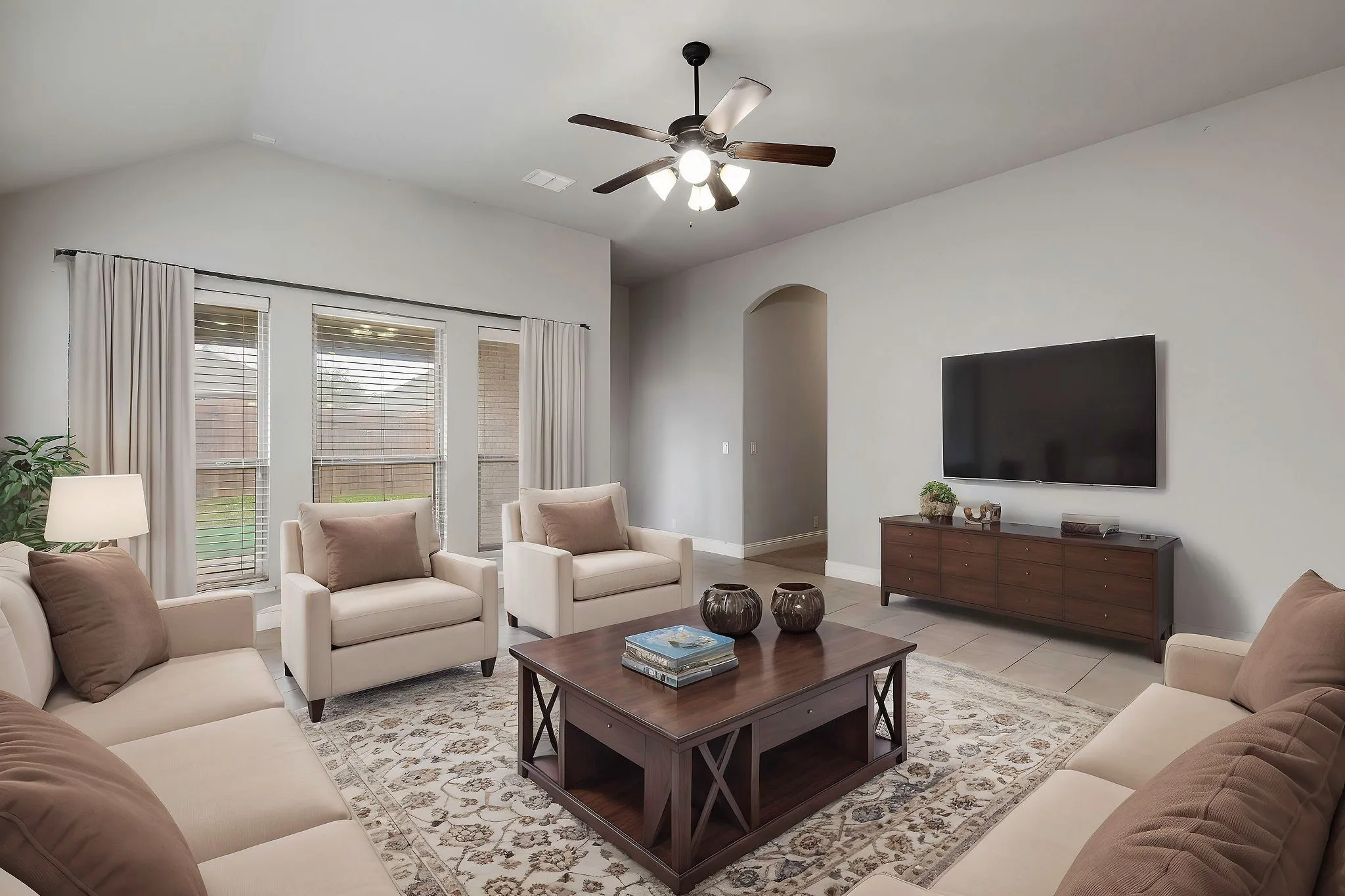 Virtually staged  vents, vaulted ceiling, baseboards, and arched walkways