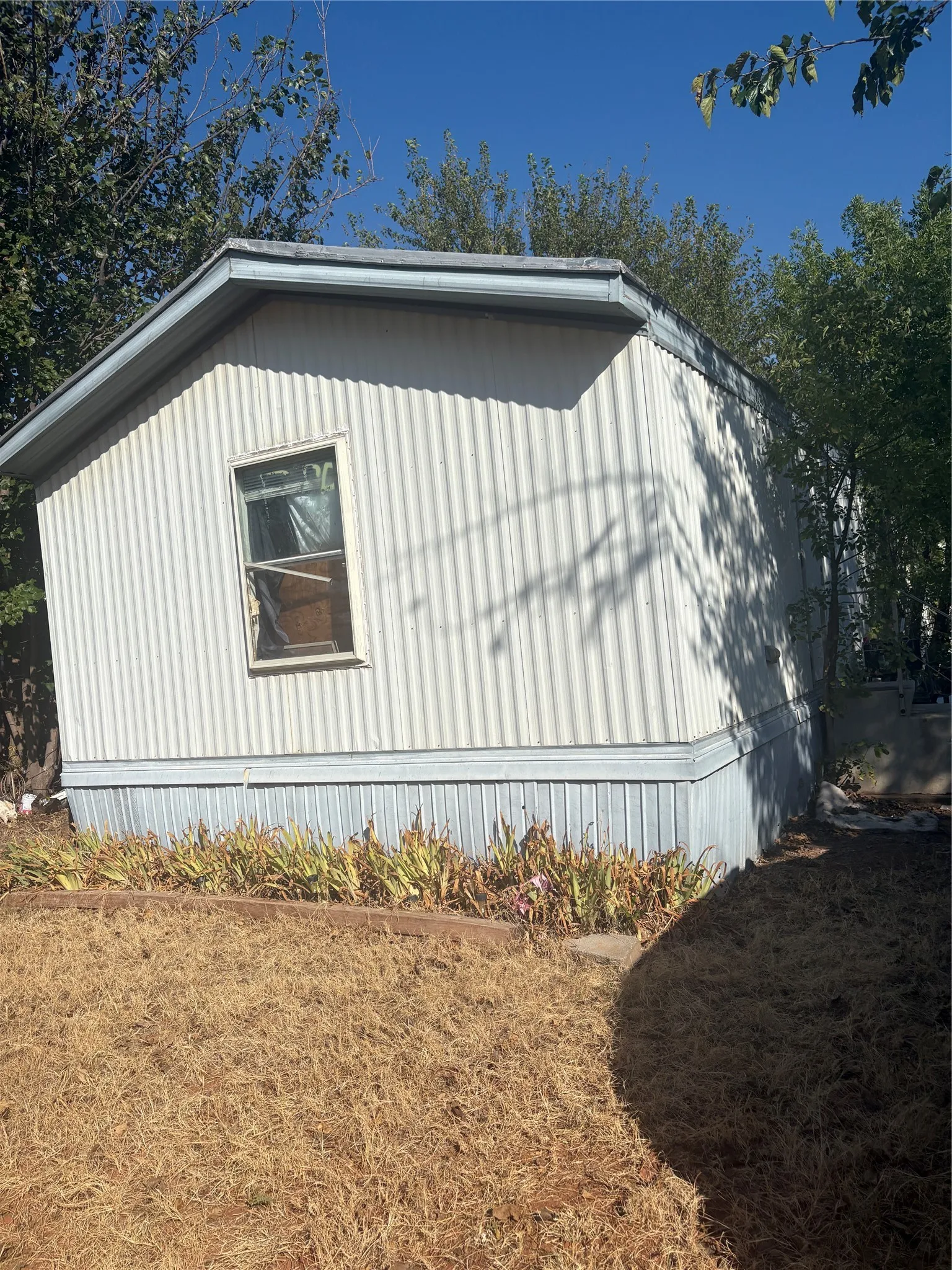Corrugated siding exterior with a single window
