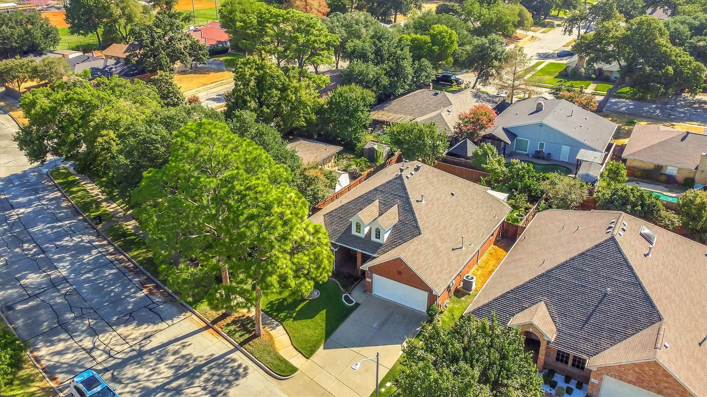 Residential neighborhood featuring mature trees and established homes