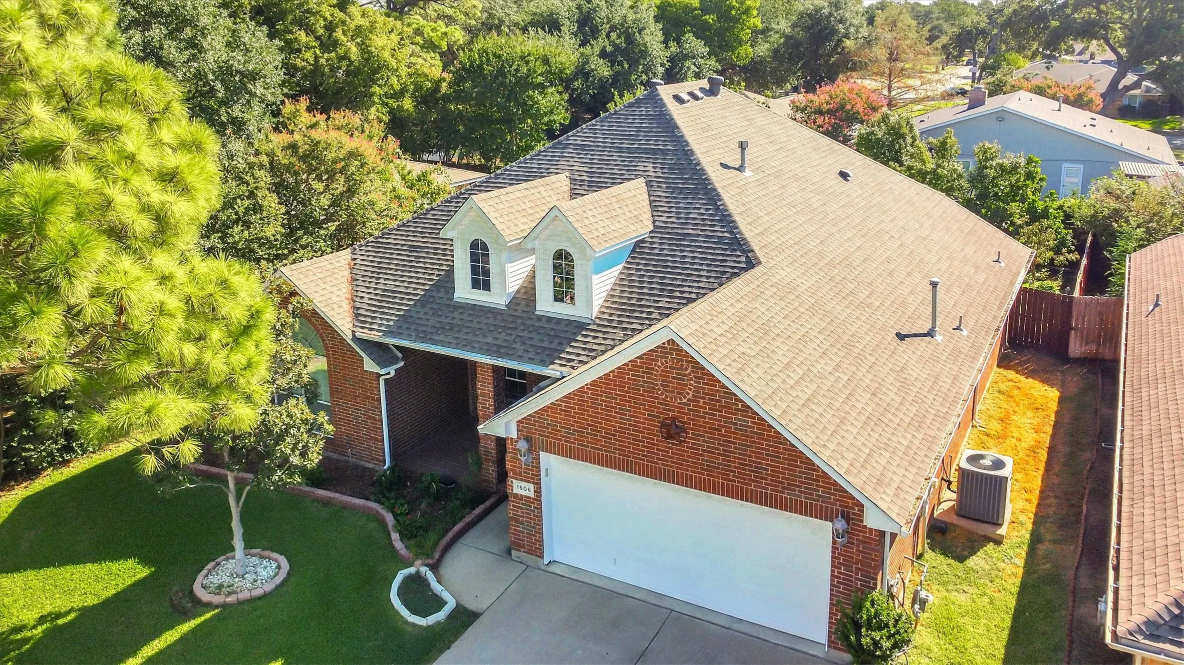 Brick exterior with a white garage door