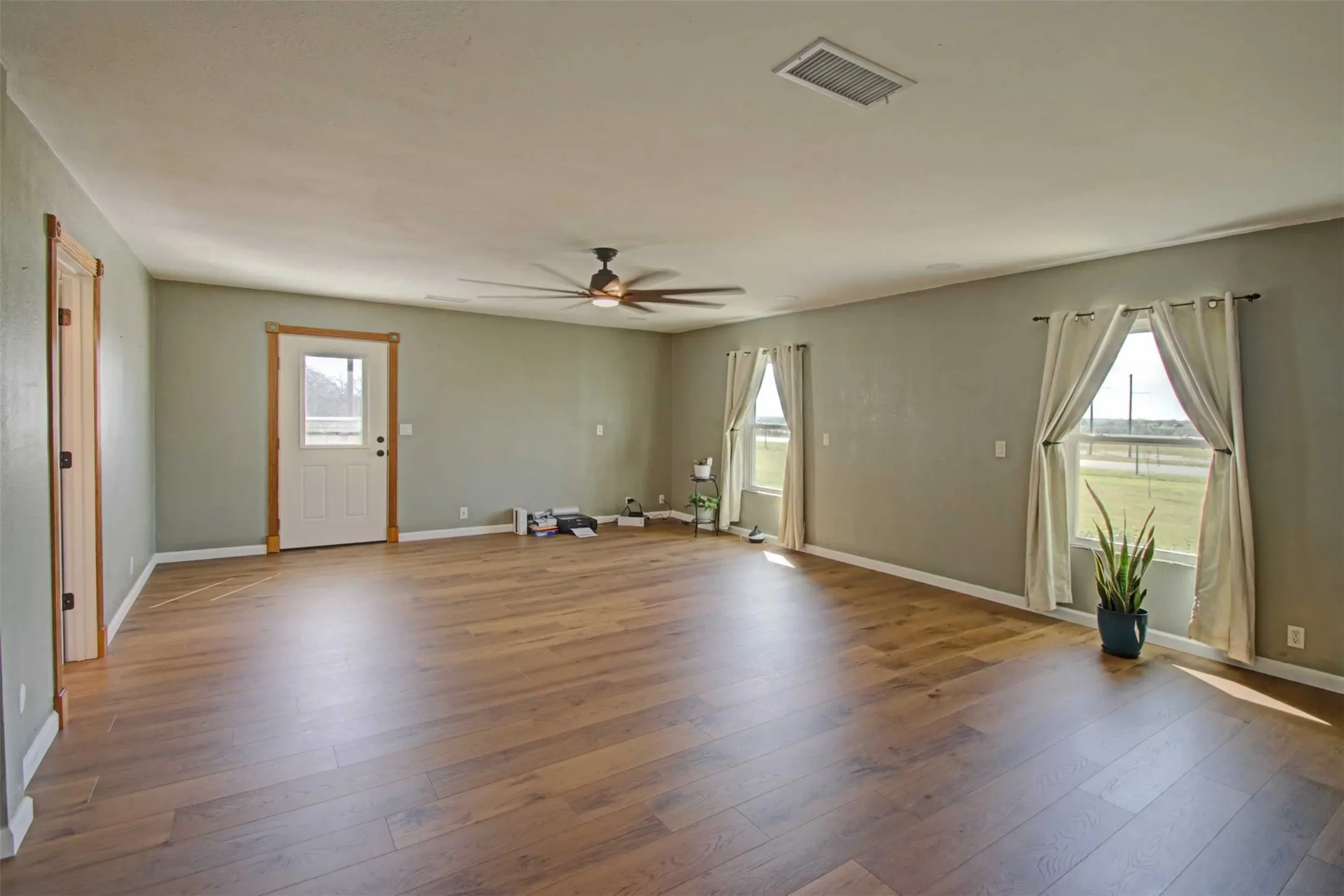 Primary bedroom is large enough for your oversized bed plus other pieces of furniture. The outside door opens to a private deck overlooking the inground diving pool.