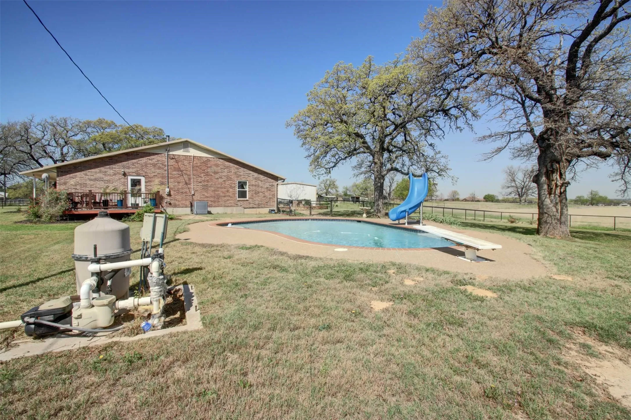 Diving pool with slide and diving board. Lots of fun just waiting for your swimmers.