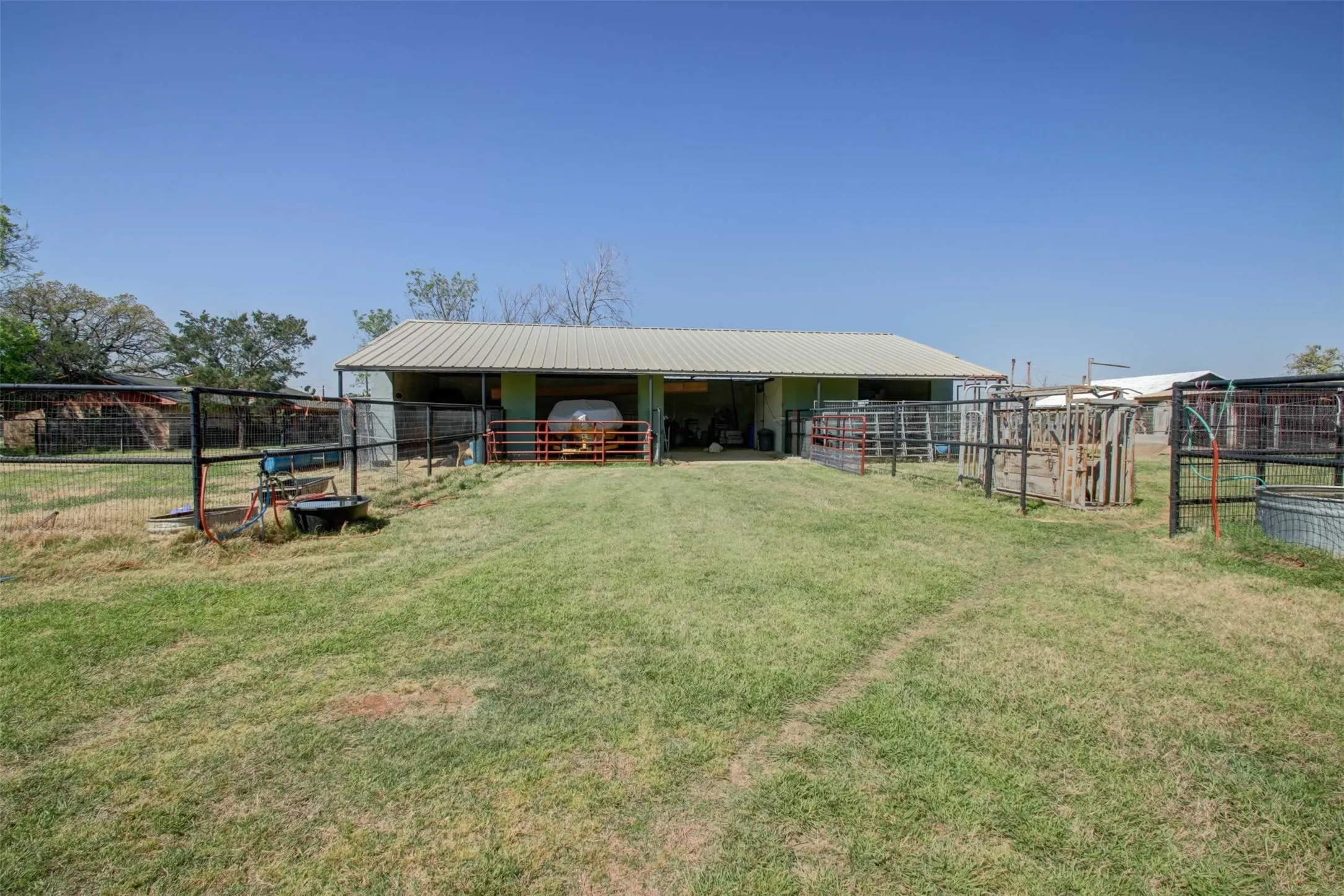 The barn has electricity, water, stalls and a secure feed/tack room.  There's also some small turn outs.