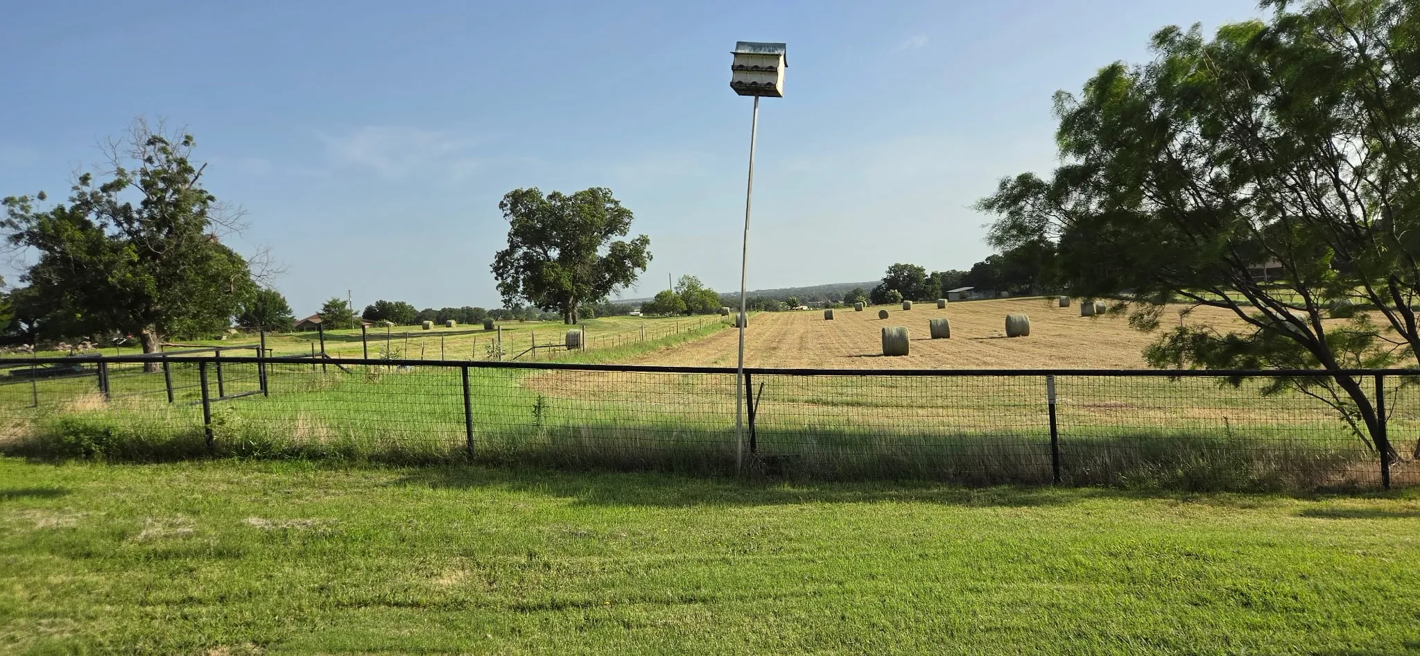 A view of a portion of the hay bales cut on 12 of the 14 acres. This is horse grade hay worth about $100.00 per bale.  This is a working farm and the hay helps pay the bills.