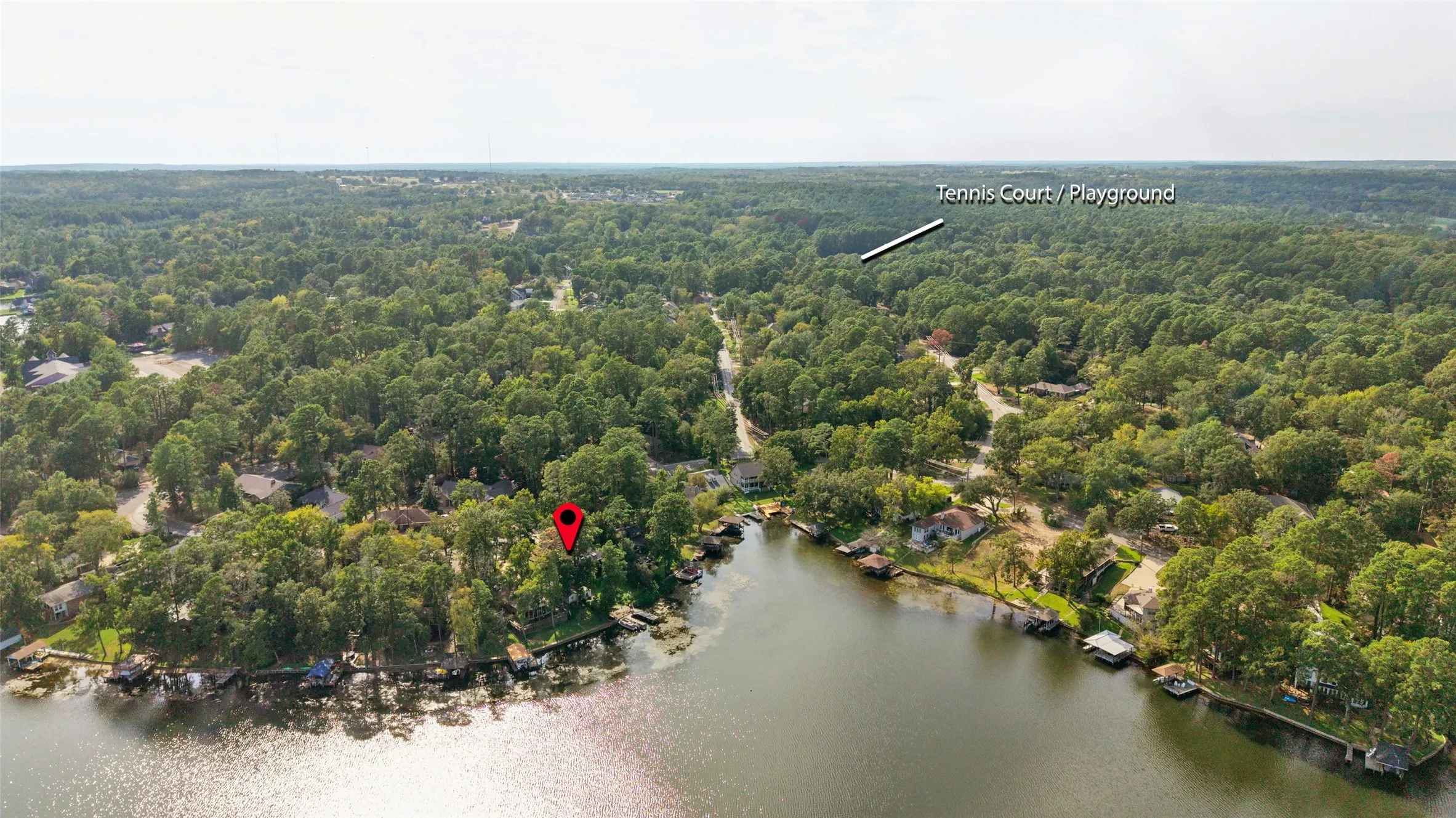 Waterfront property with extensive tree coverage and surrounding residential structures & close to amenities. Tennis Court / Playground.