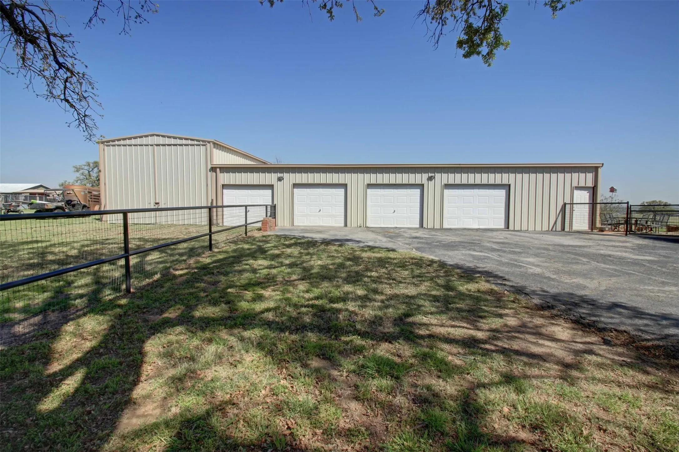 This garage is large enough to 4 vehicles or farm equipment or have a nice workshop. the 5th garage will accommodate a large camper or RV. There is no entry to the RV spot from the garage but the other 4 sparts are open creating a huge area for lots of things.