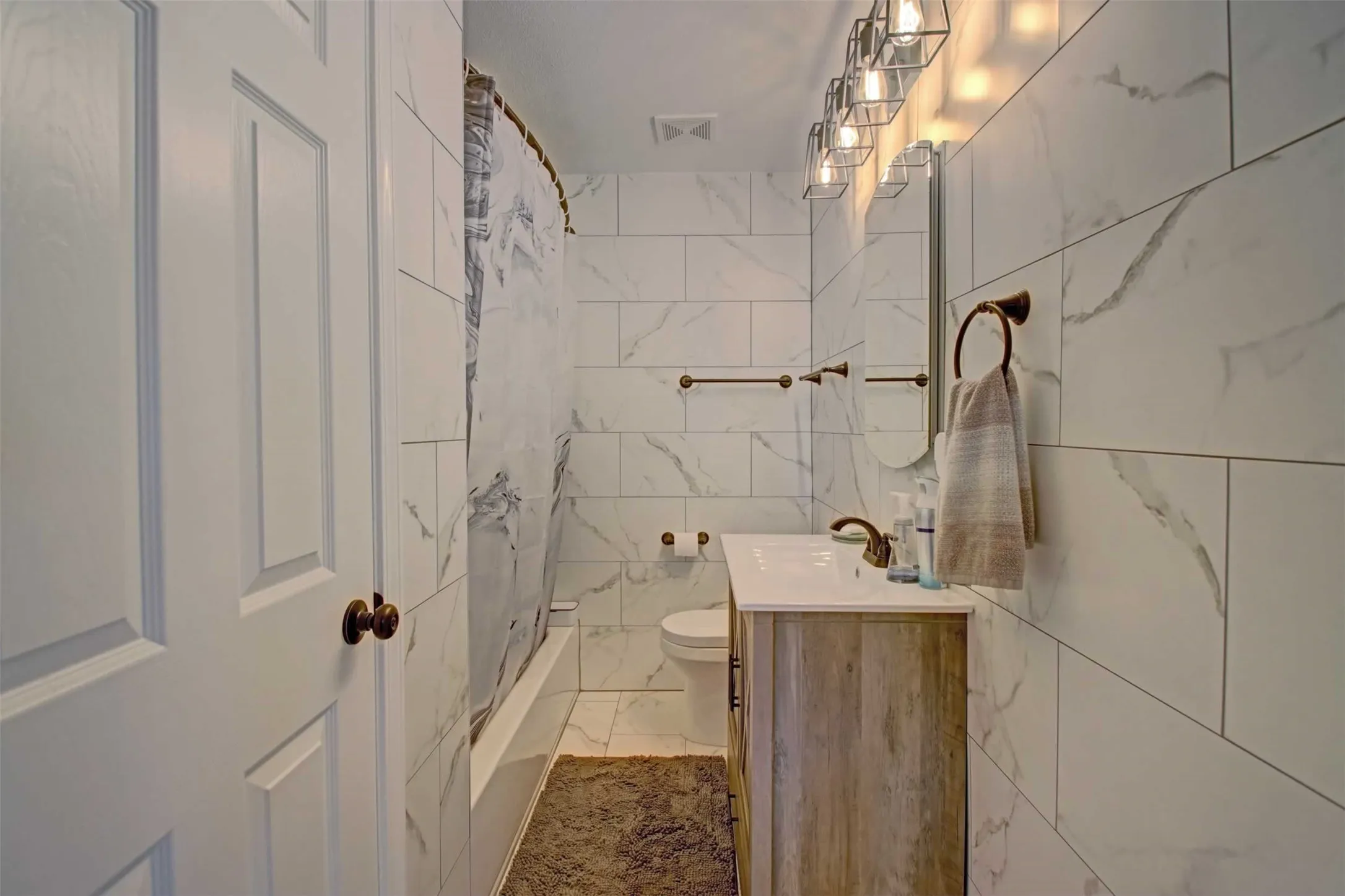 Second bath has also been recently remodeled with tile walls and updated hardware.