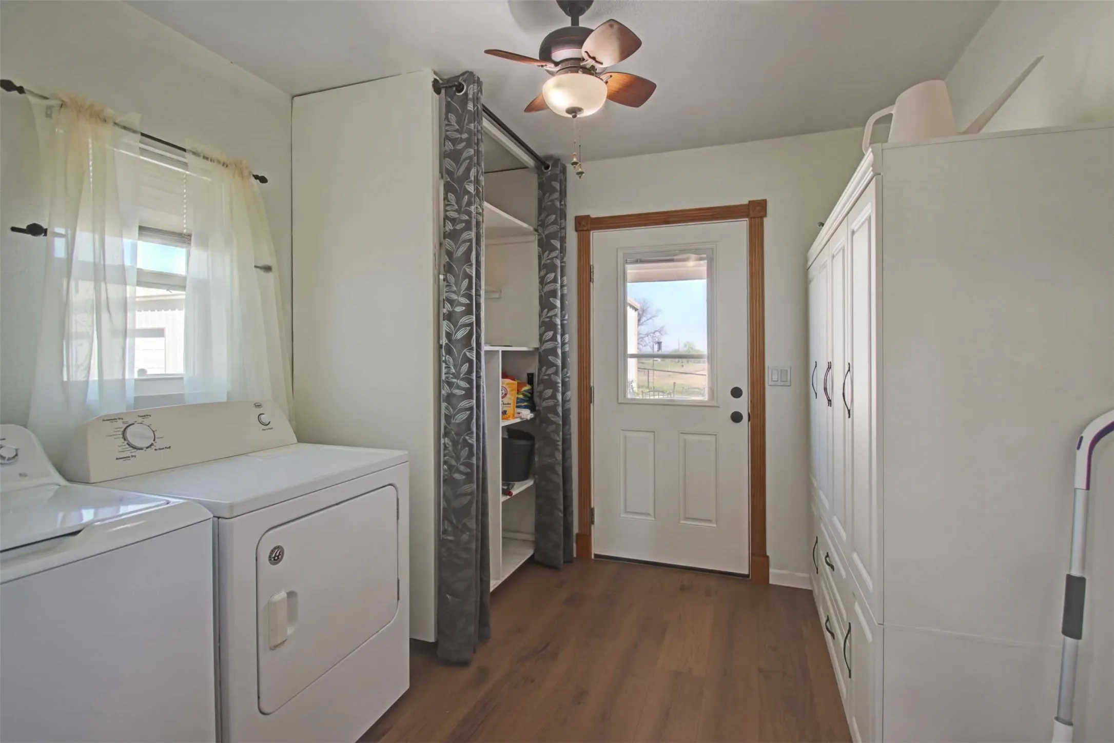 Room for full size washer and dryer plus lots of cabinet space. This makes a great mudroom just inside the back door.