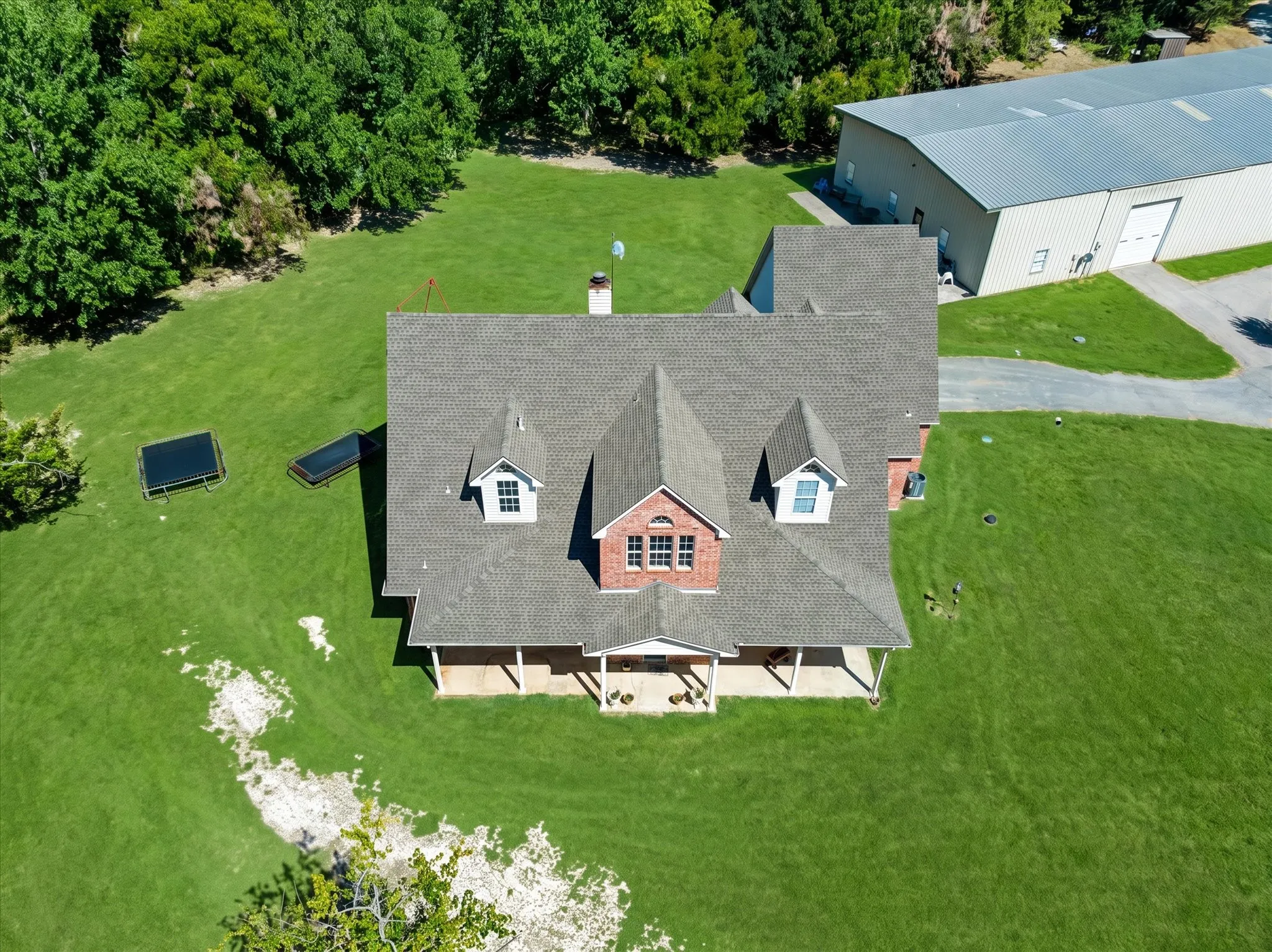 Brick and siding exterior with a multi-gabled roofline
