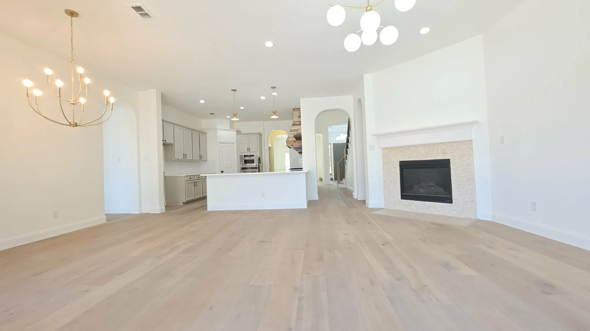 Light wood-finish flooring complements white walls