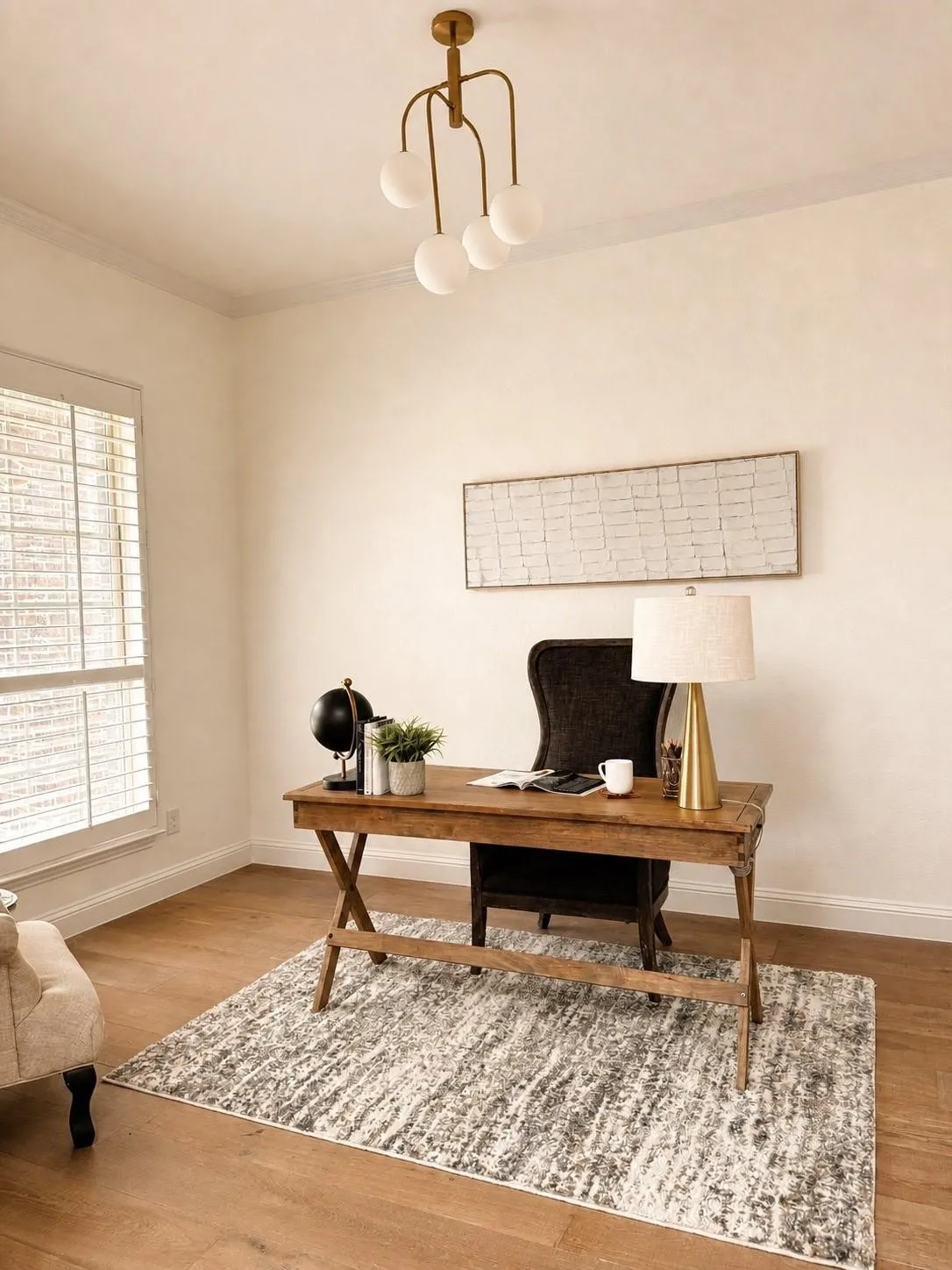 Wood-finish flooring, crown molding, and a modern ceiling light fixture
