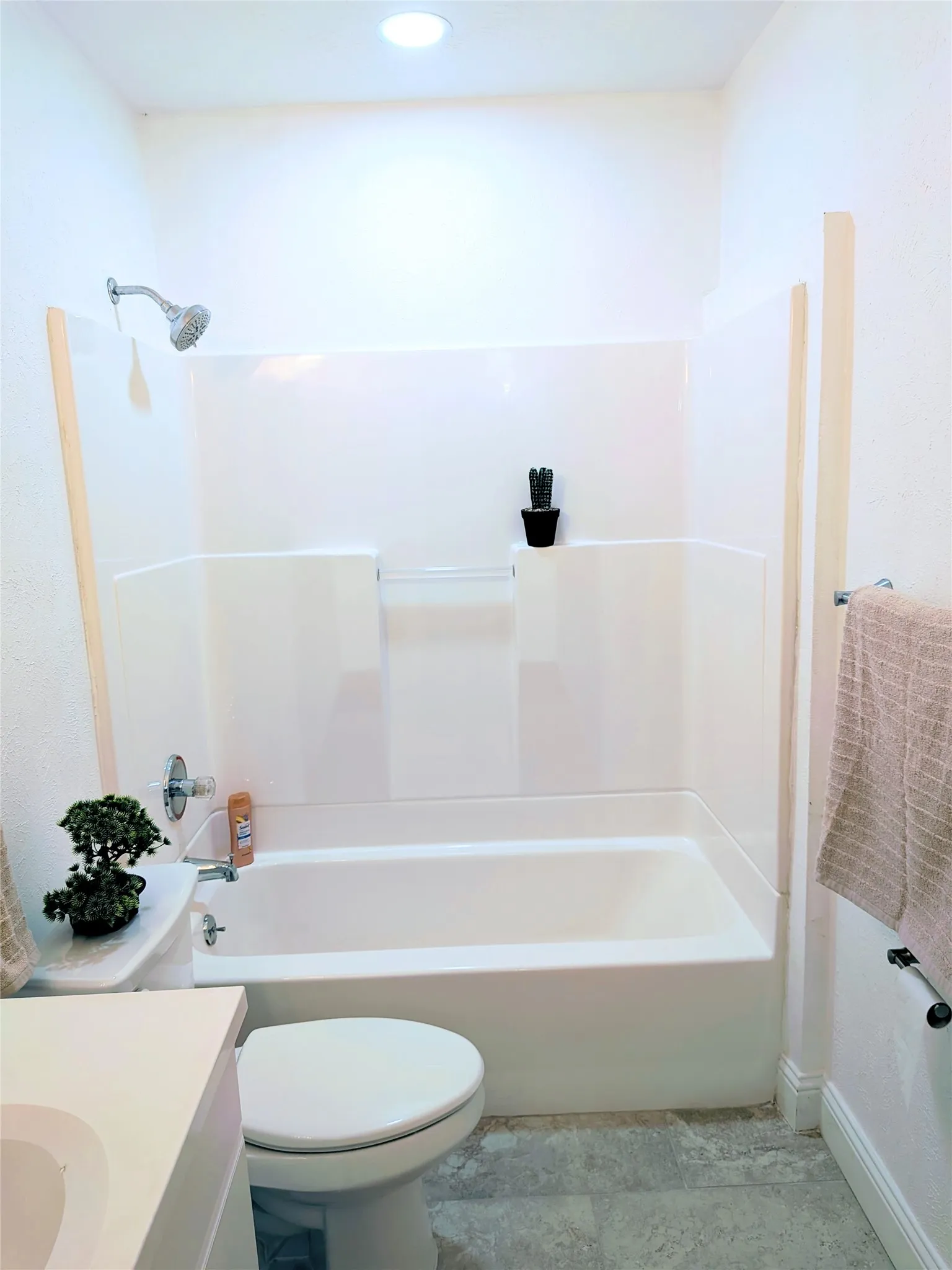 White bathtub and shower combination unit