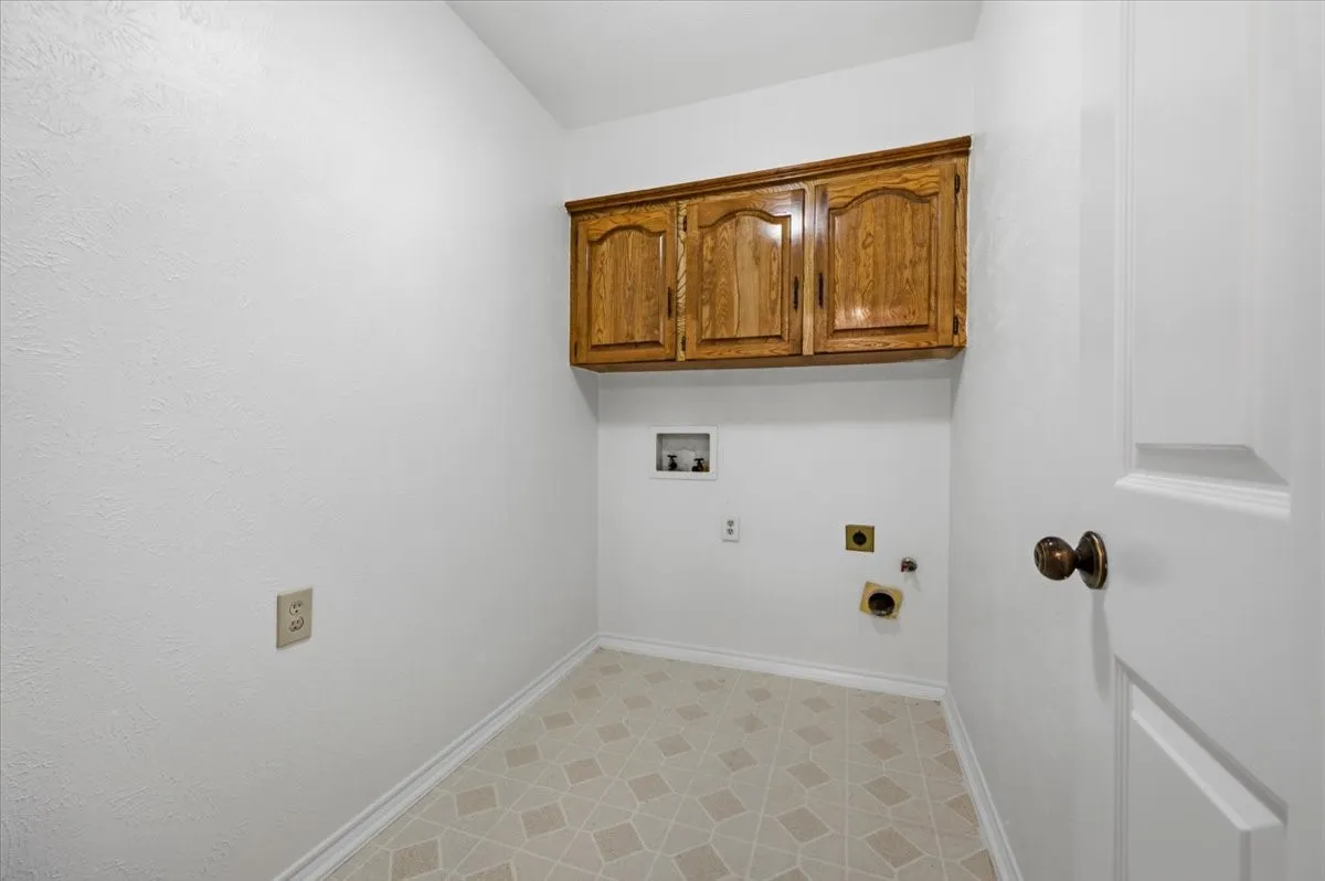 Full size laundry with cabinets for storage right off the garage - gas a electric connection for clothes dryer
