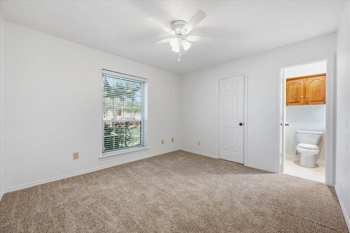 Bedroom #2 with JACK N JILL BATHROOM WITH HUGE WALK IN CLOSET  FACES FRONT  total carpet and paint 8/2026
