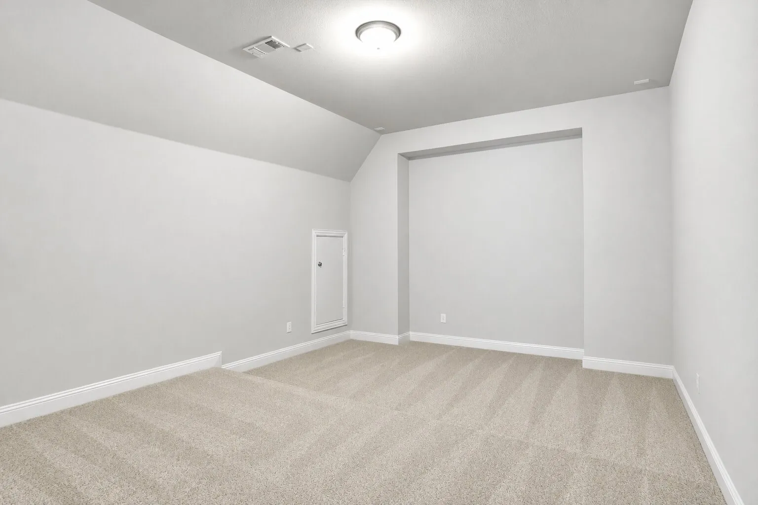 Unstaged upstairs game room with a vaulted ceiling and generous space for entertainment, gaming, or a secondary living area. Photos have been AI enhanced for presentation; no material property features were altered.
