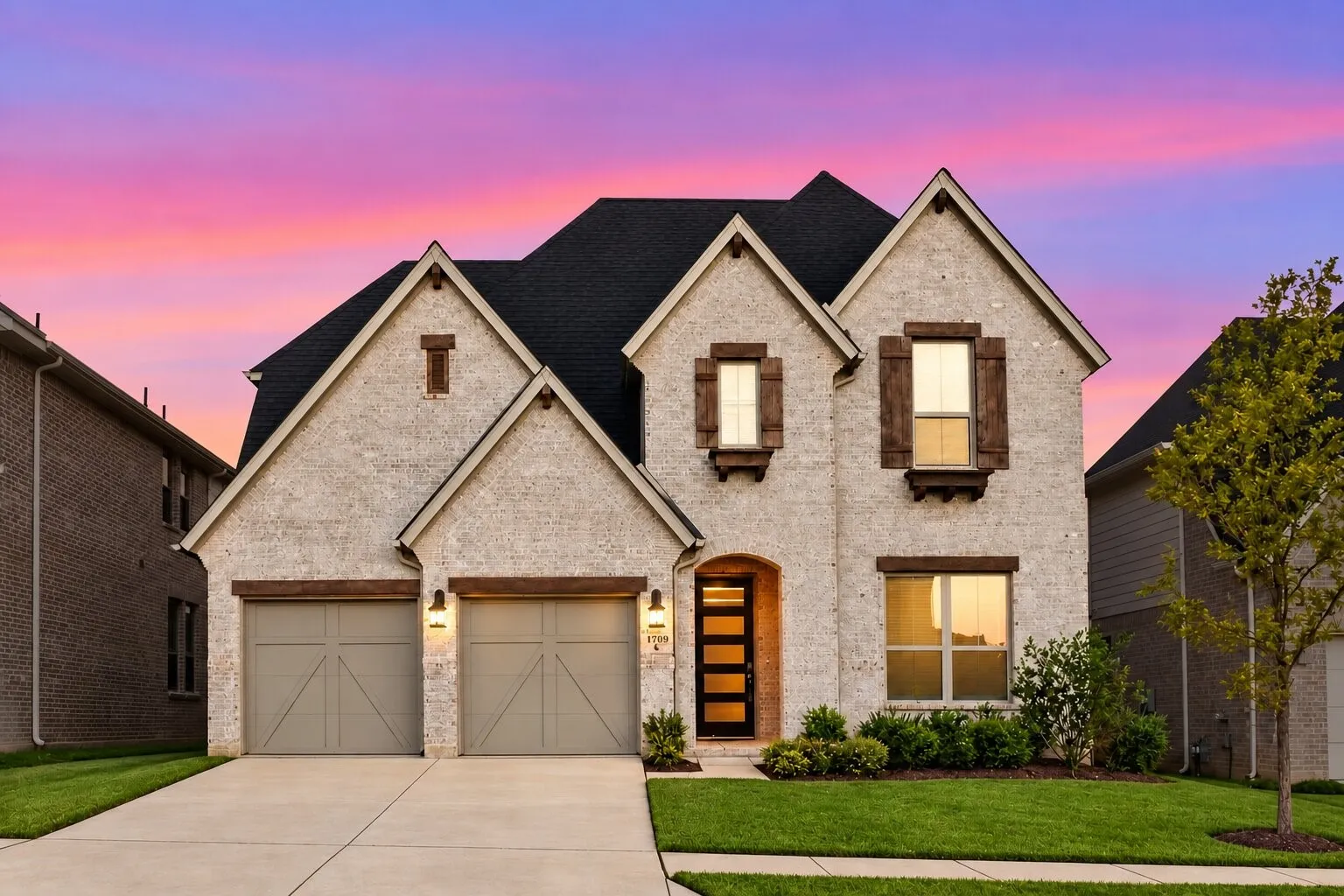 Welcome to this striking two-story brick home, offering standout curb appeal, a two-car garage, modern architectural details, and beautifully maintained landscaping. Photos have been AI enhanced for presentation; no material property features were altered.