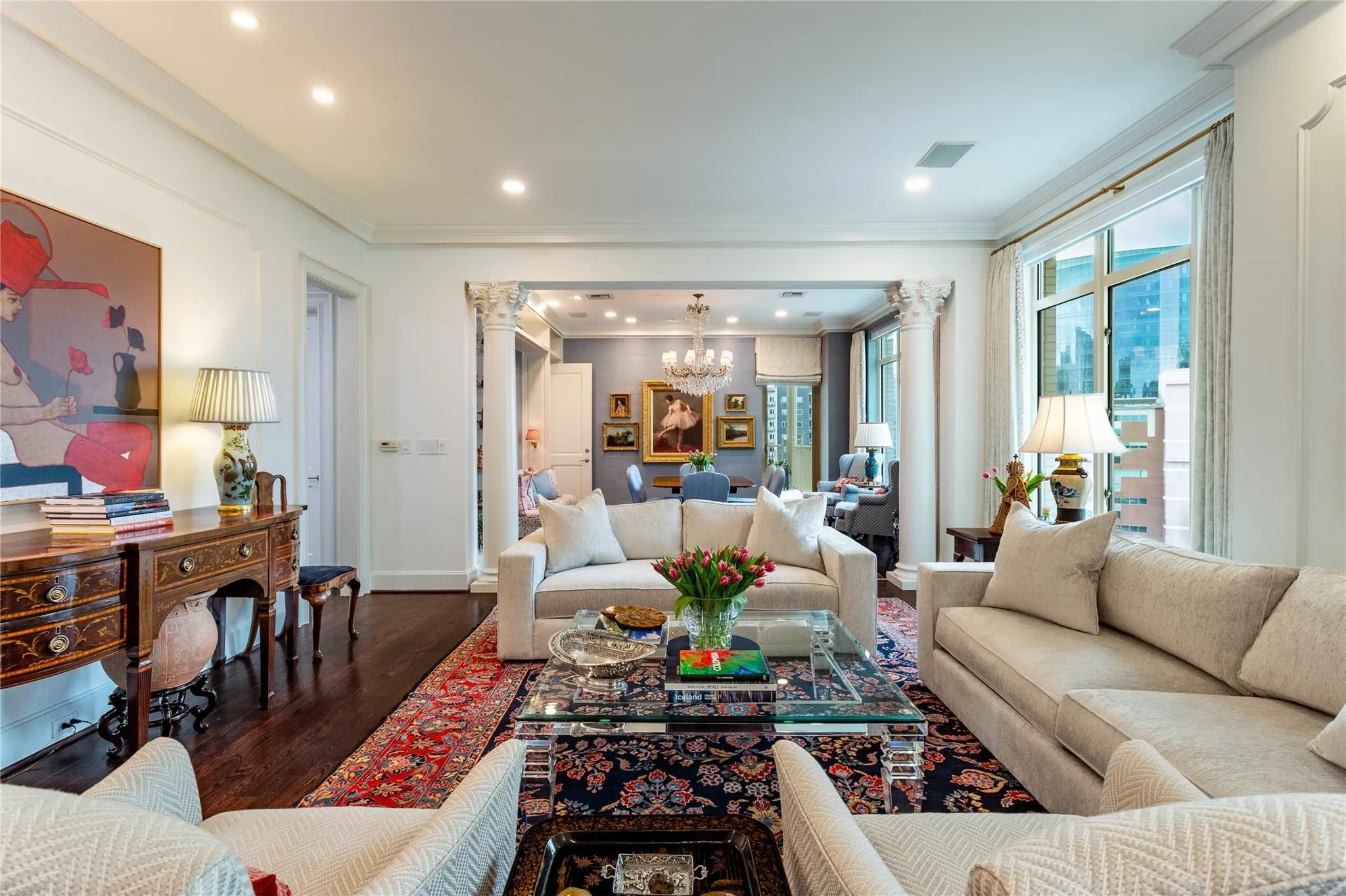 Living opens to large Dining flanked by Corinthian columns