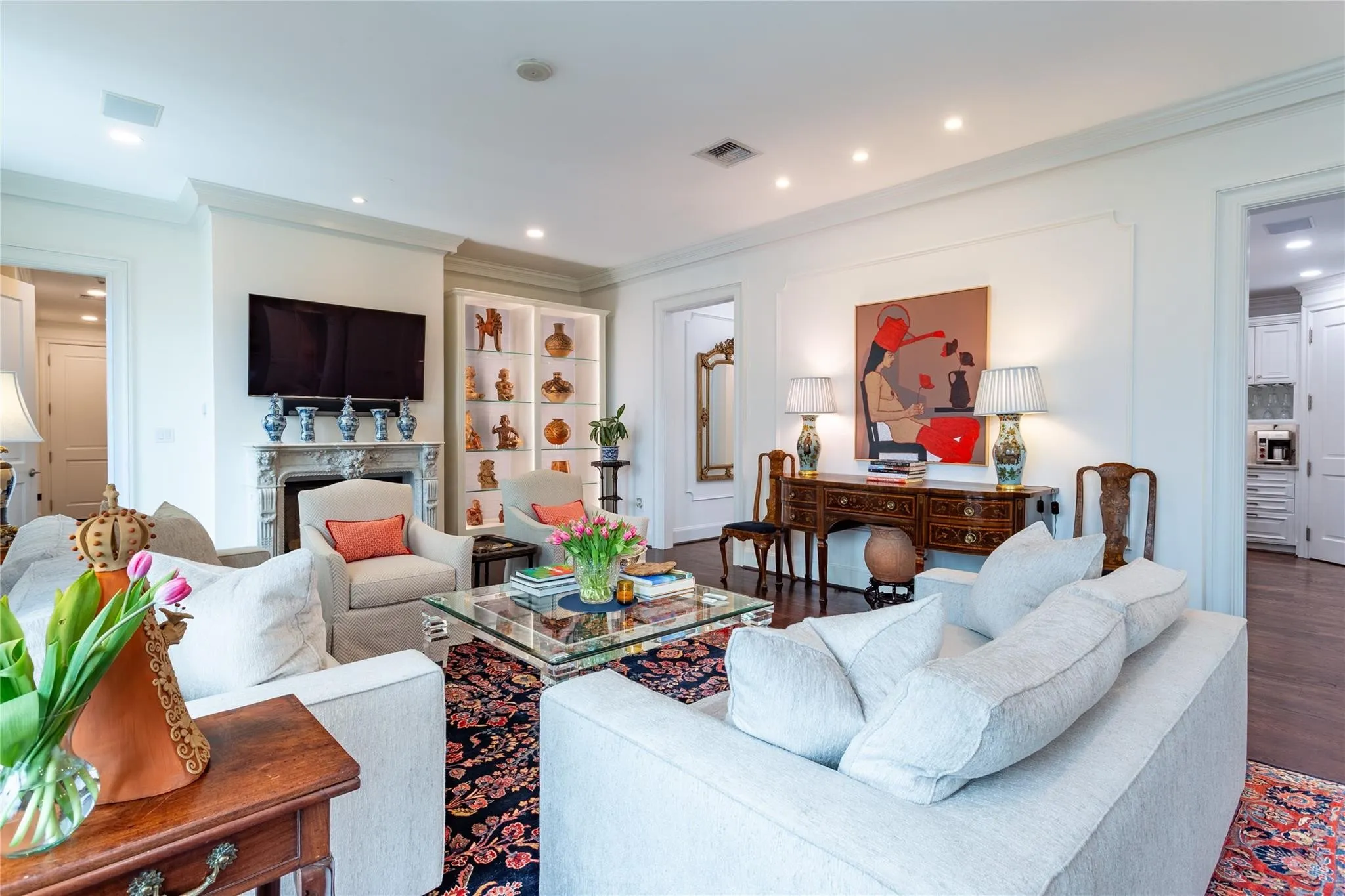 The heart of the home leads to Kitchen & Powder Room