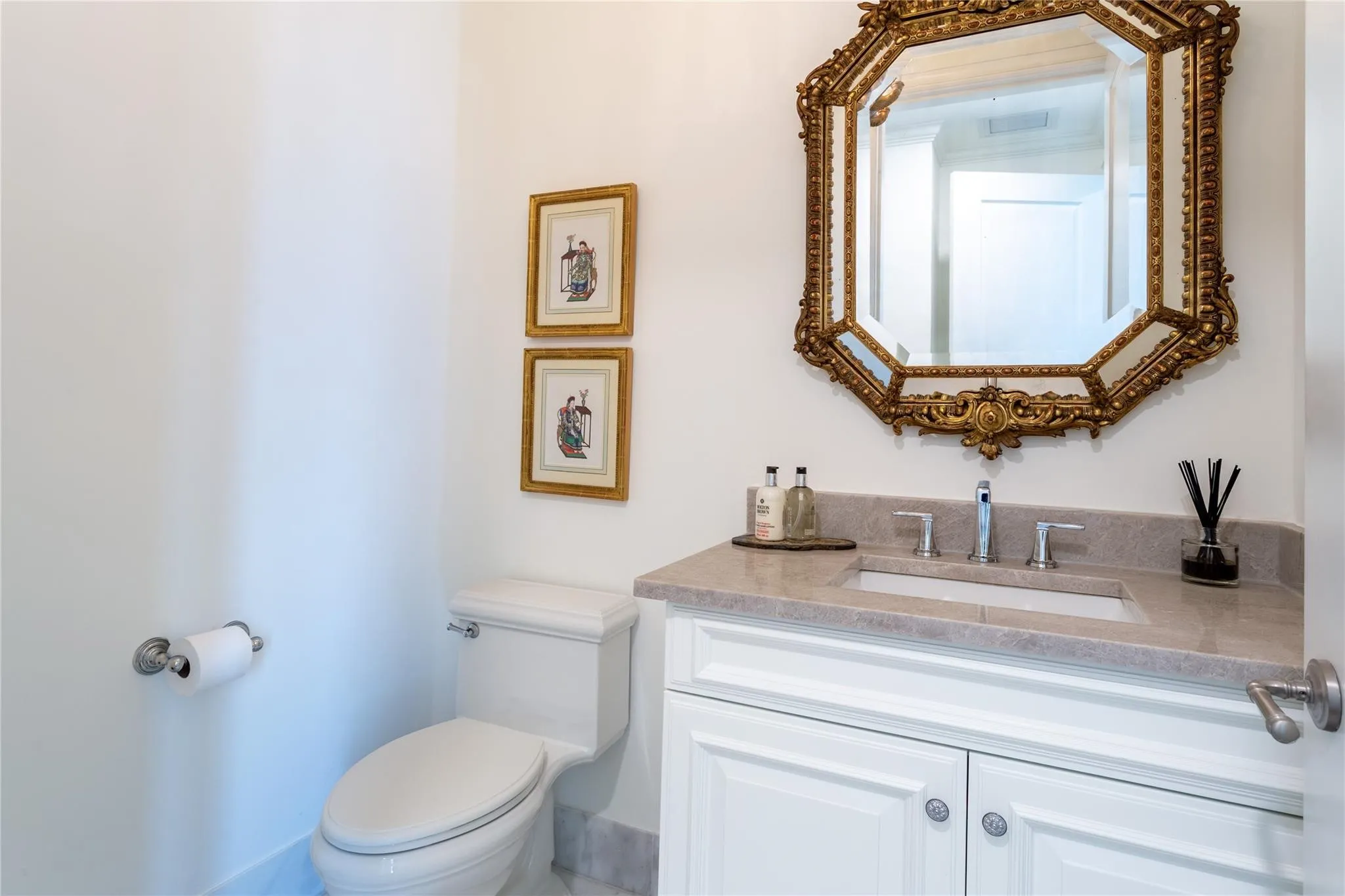 Discrete Powder Room off the guest hallway.
