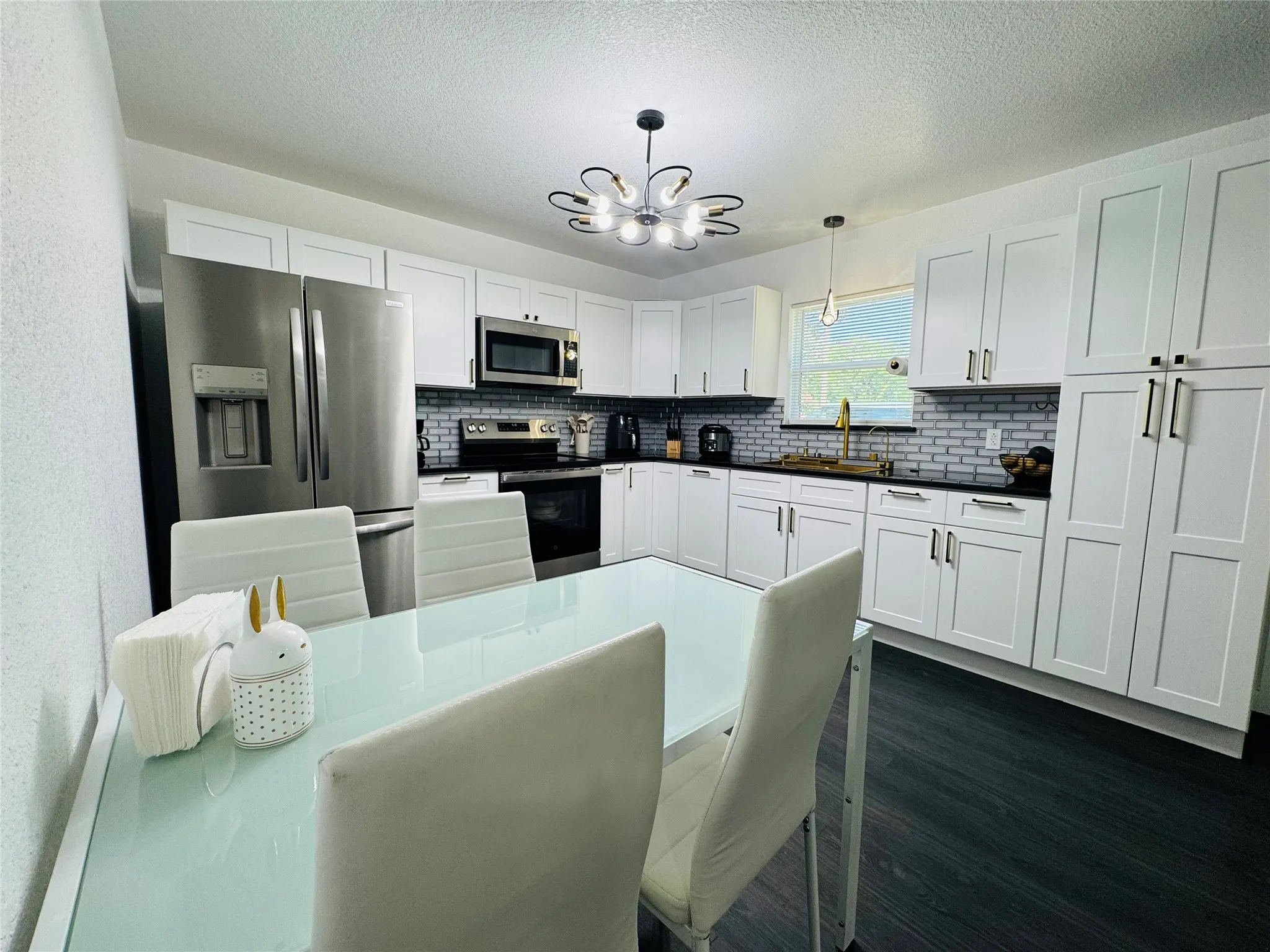 Open-concept living area with dark wood-finish flooring