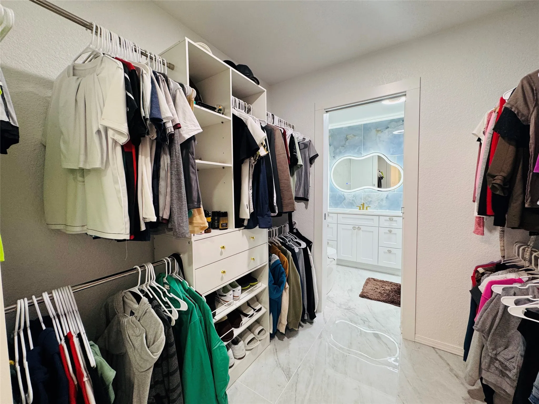Custom closet system with integrated shelving and drawers