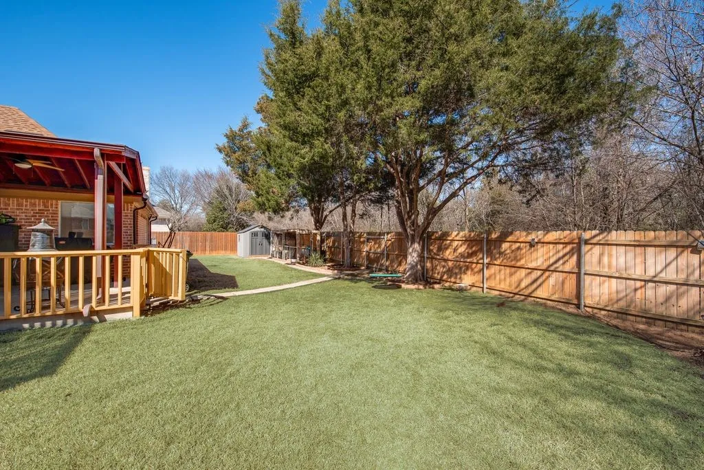 View of yard featuring an outbuilding, a shed, and a fenced backyard