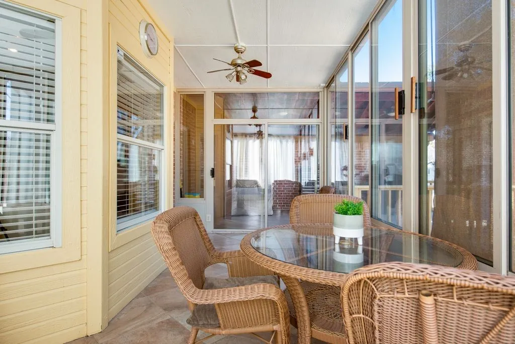 Sunroom with a ceiling fan