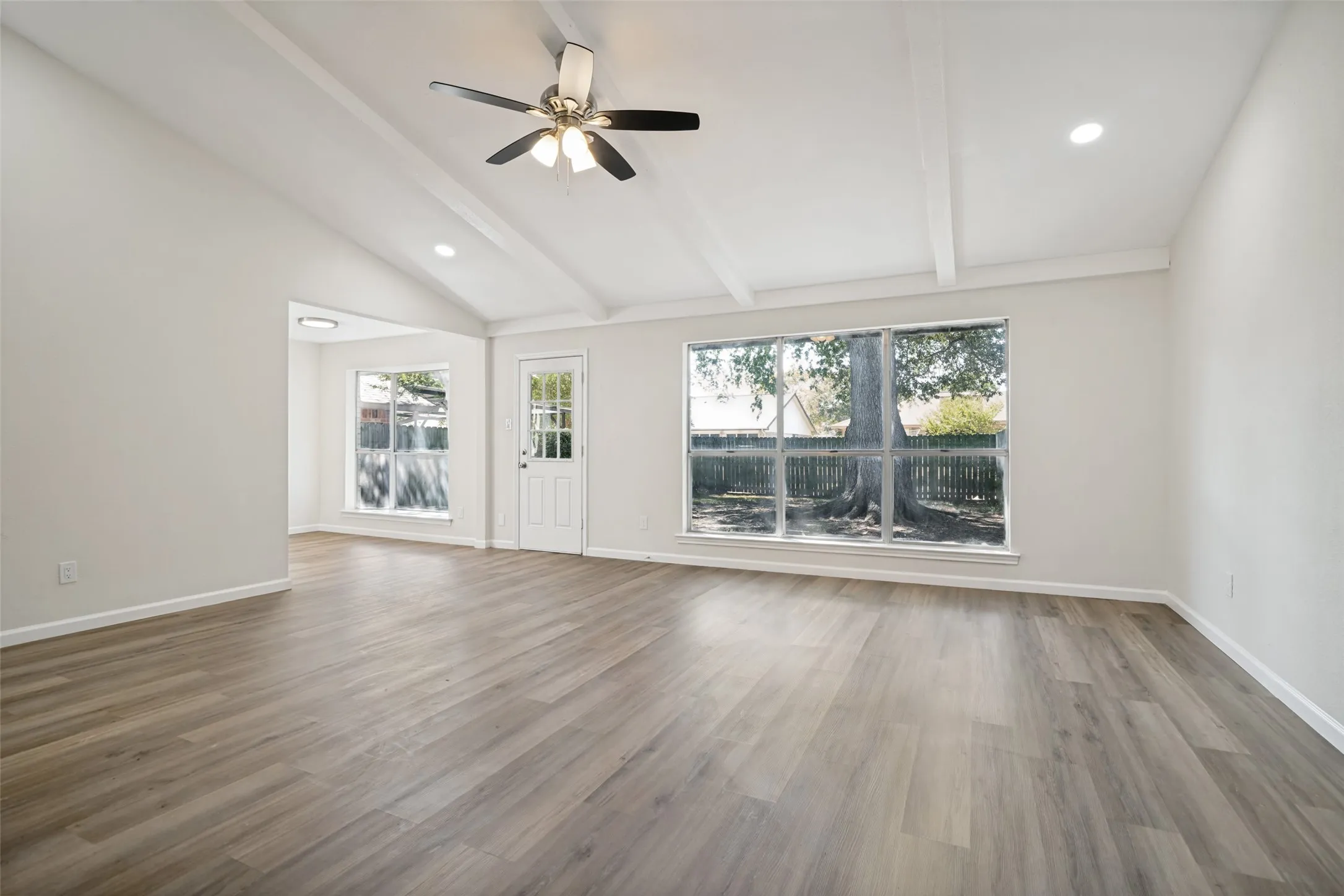 Large windows overlooking the backyard