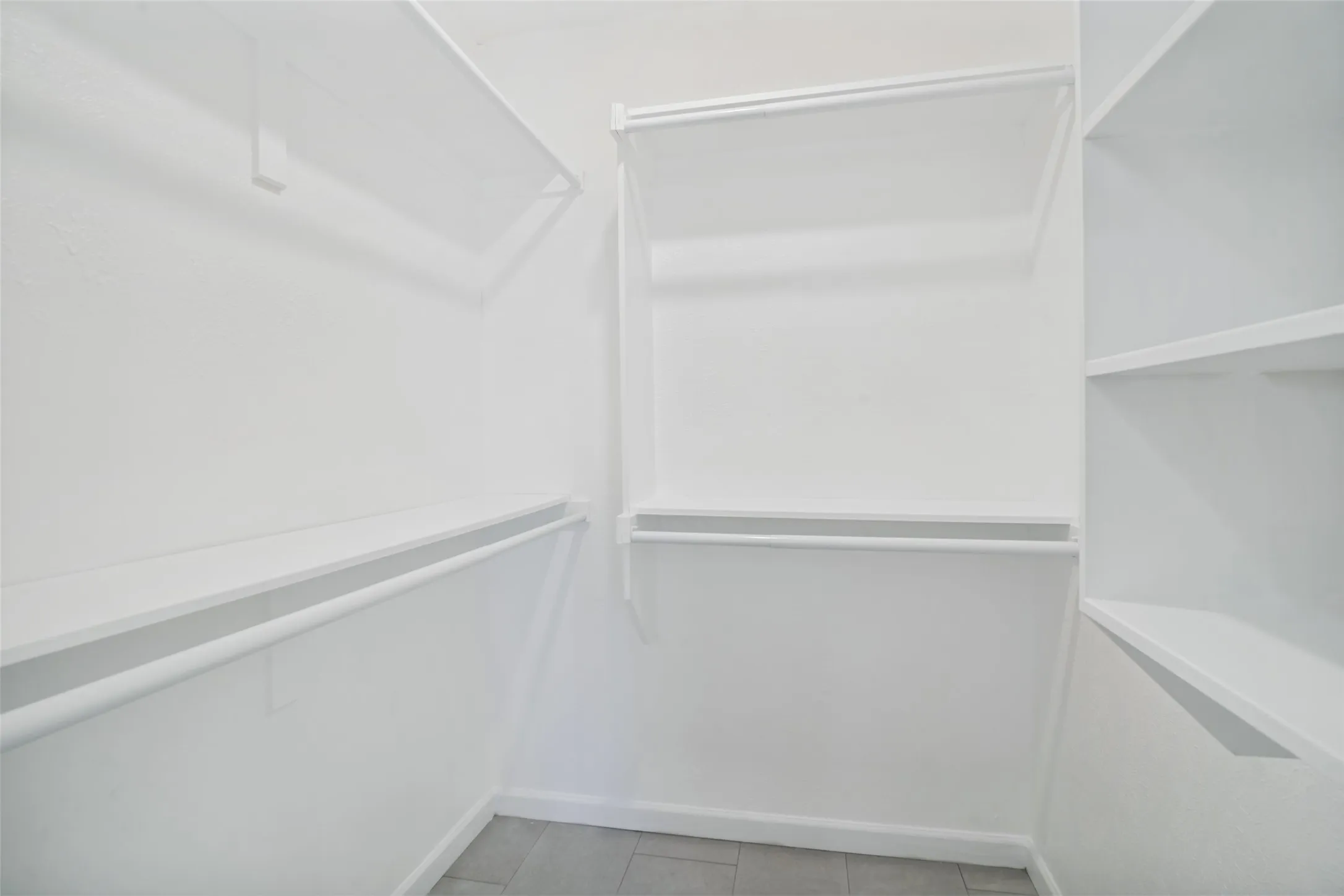 Primary bathroom has a walkin closet