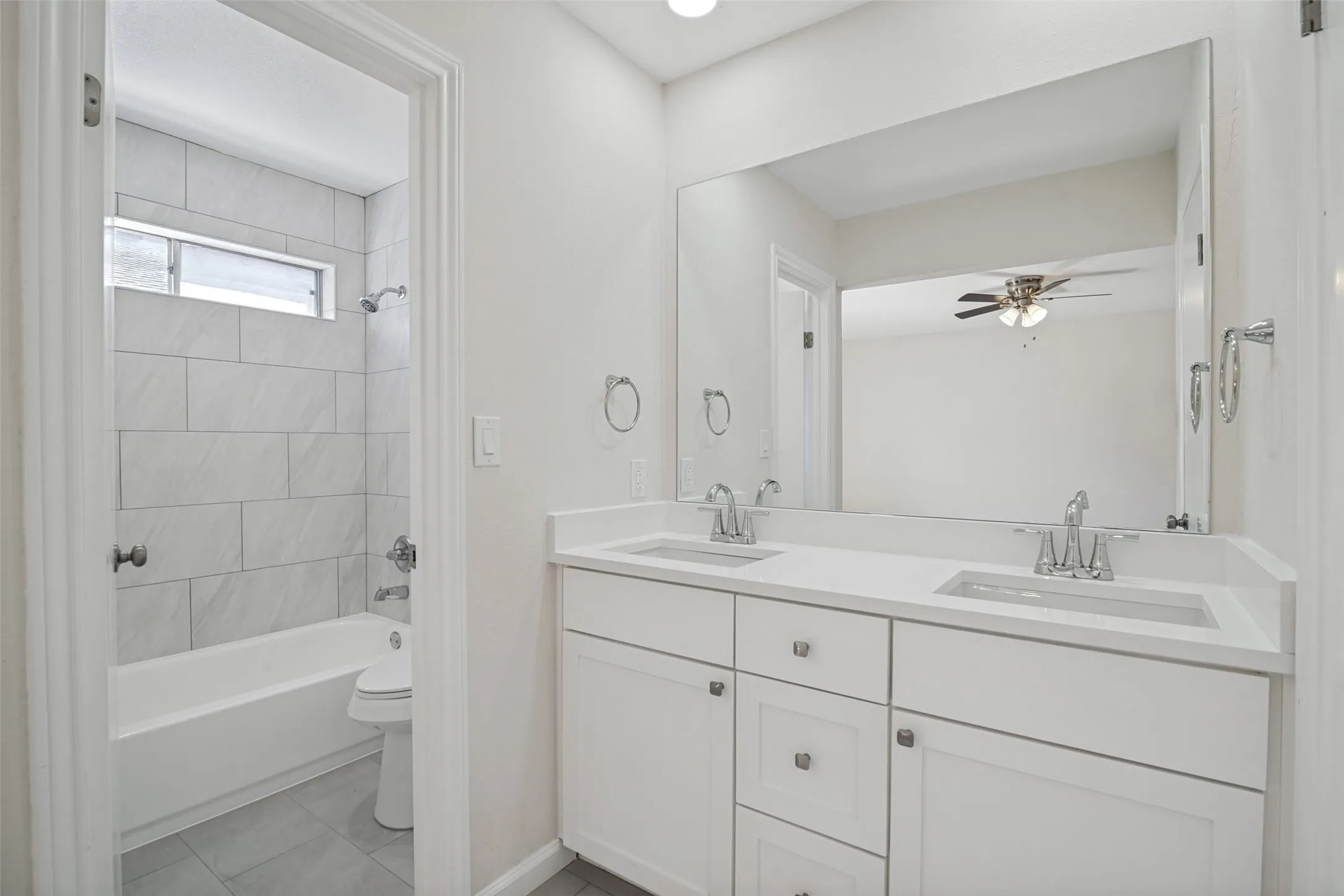 Primary bathroom with built-in cabinets