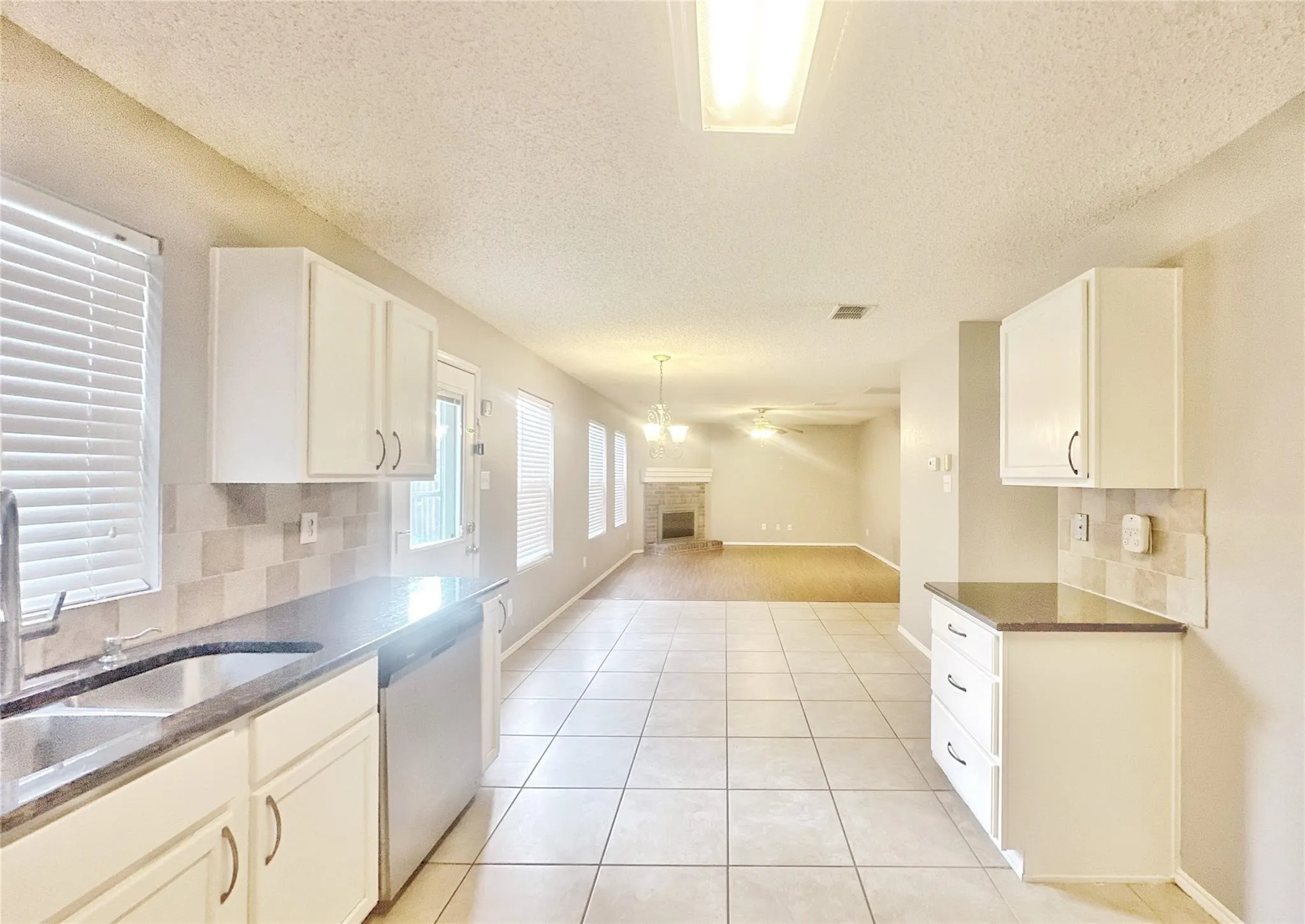 Tile flooring throughout the kitchen area