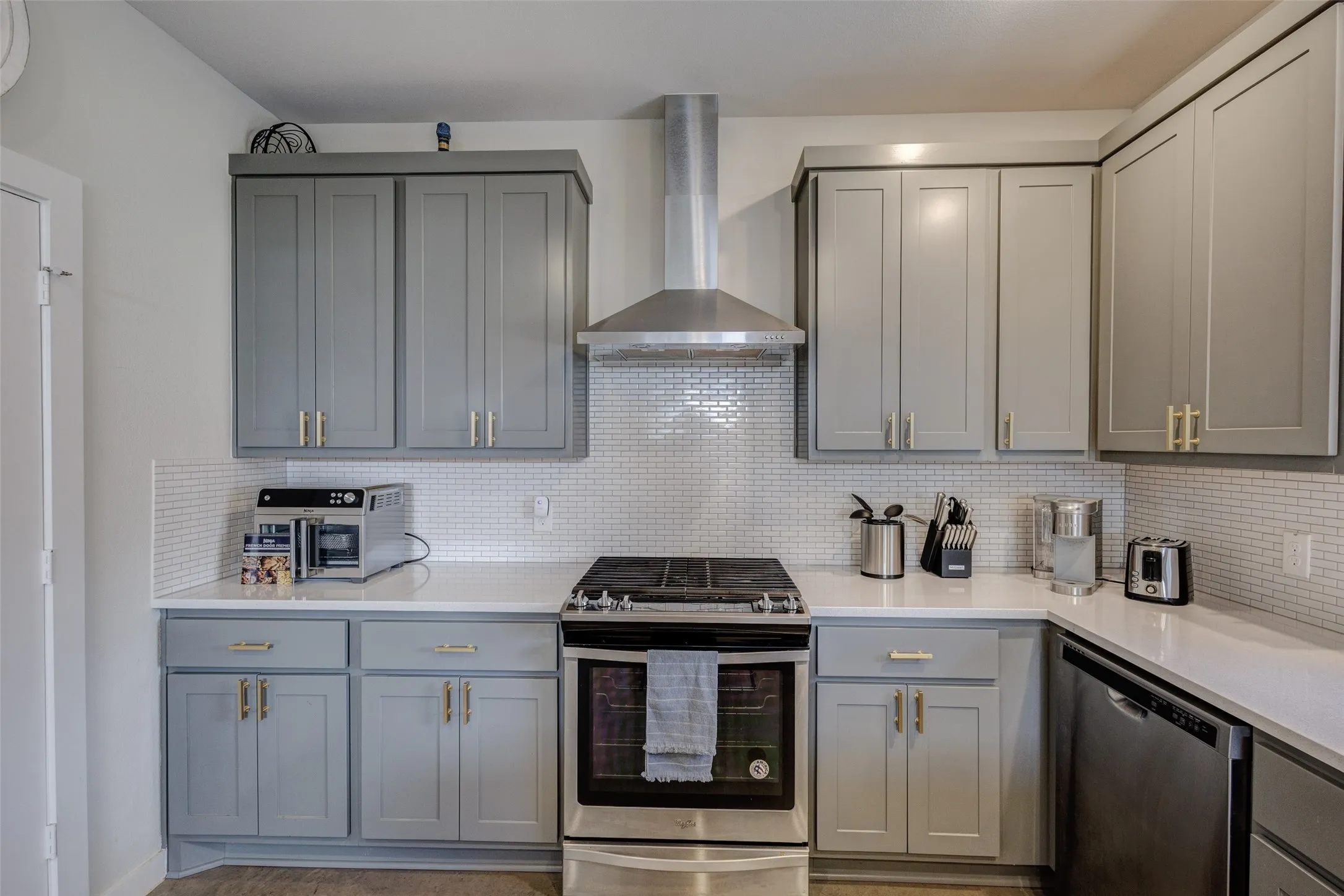 Stainless steel gas range, dishwasher and venthood