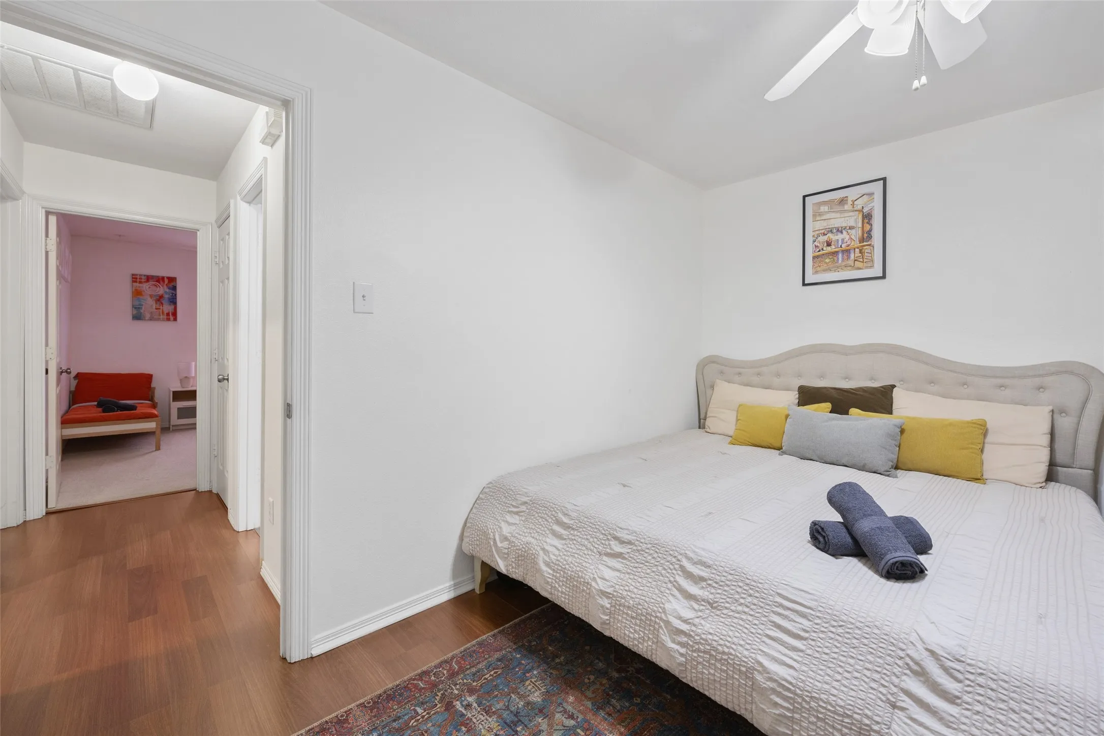 Wood-finish flooring with a decorative area rug