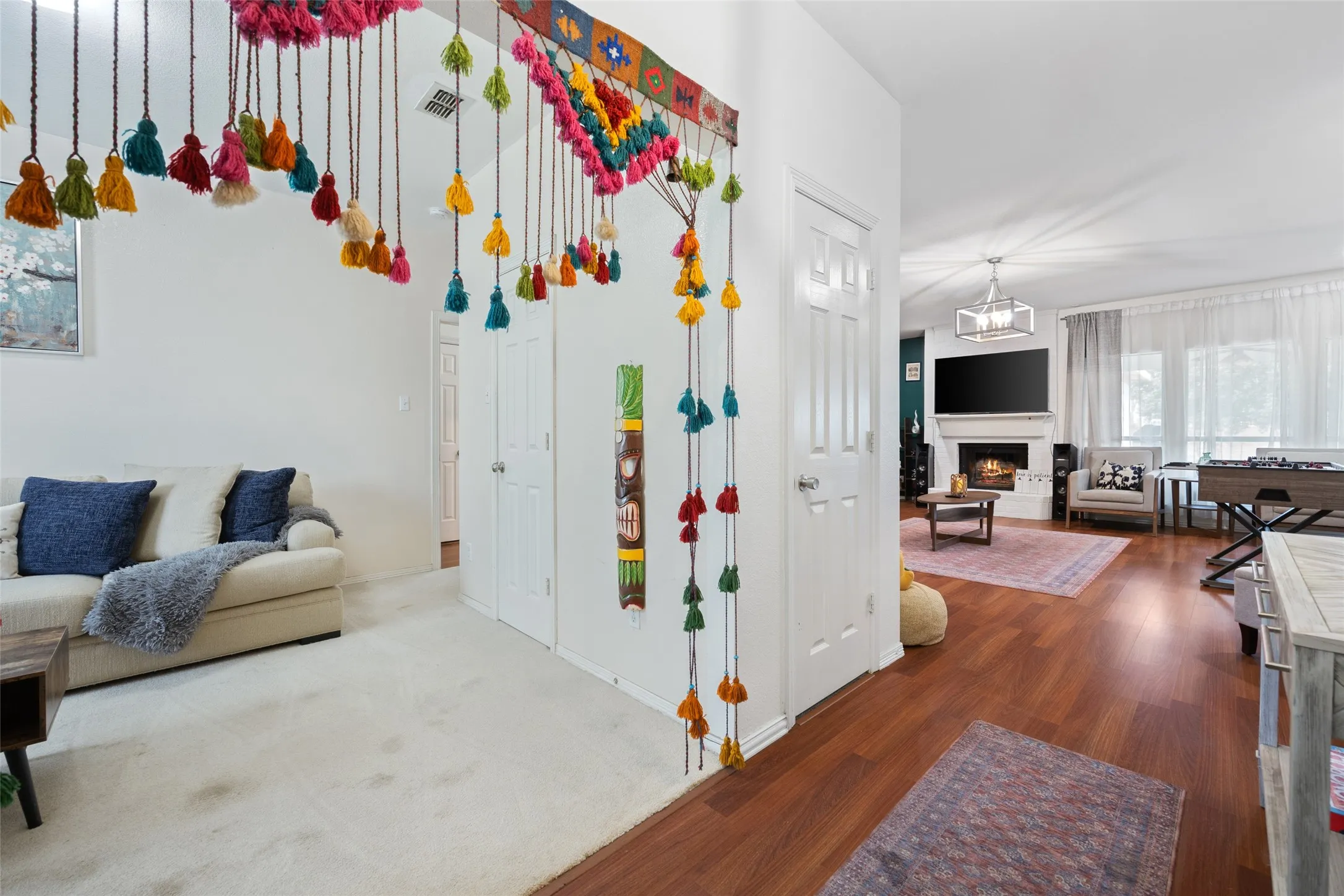 Wood-finish flooring, white paneled doors, and recessed lighting