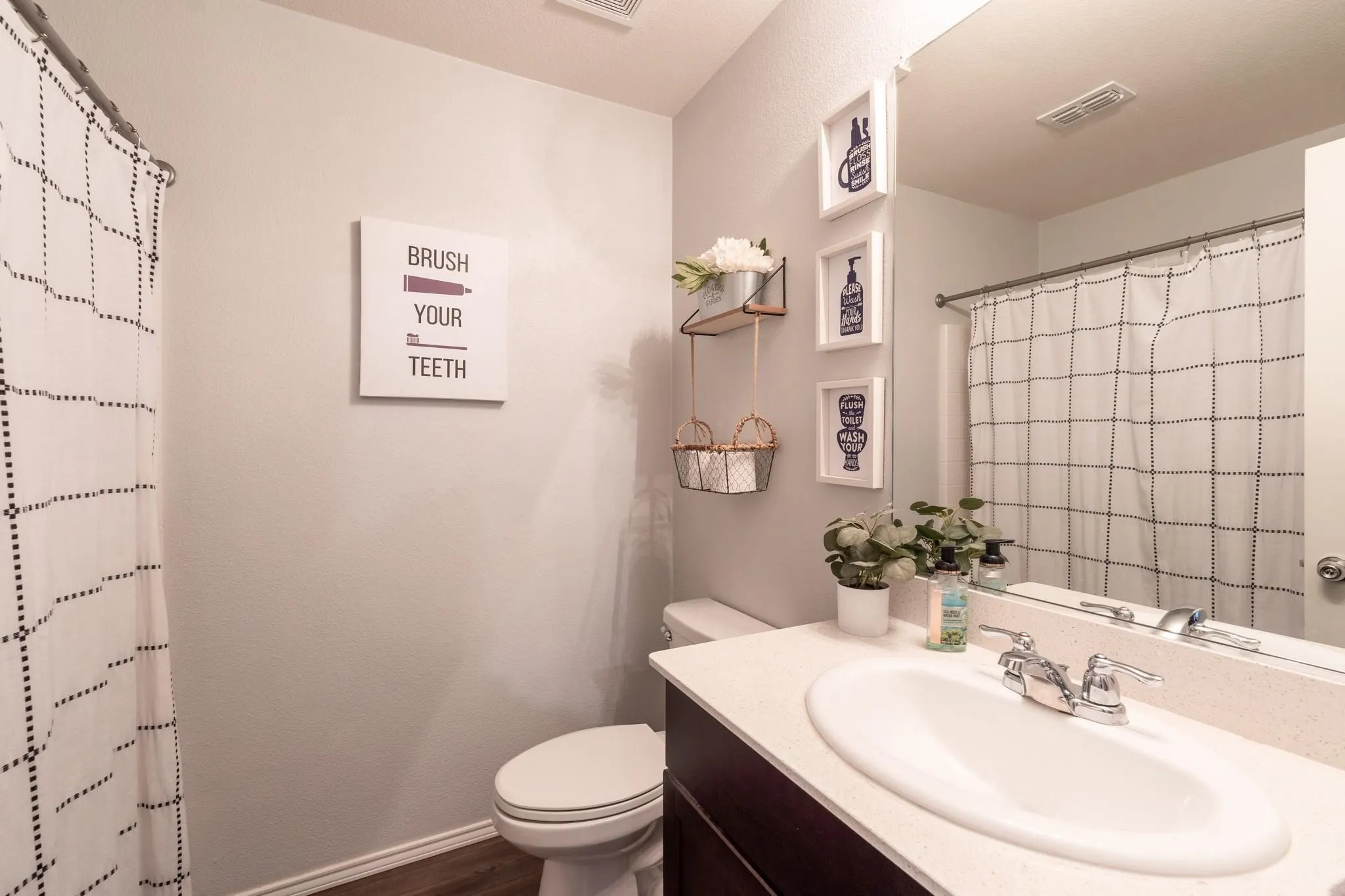Bathroom featuring oversized vanity, hardwood / wood-style flooring, and toilet