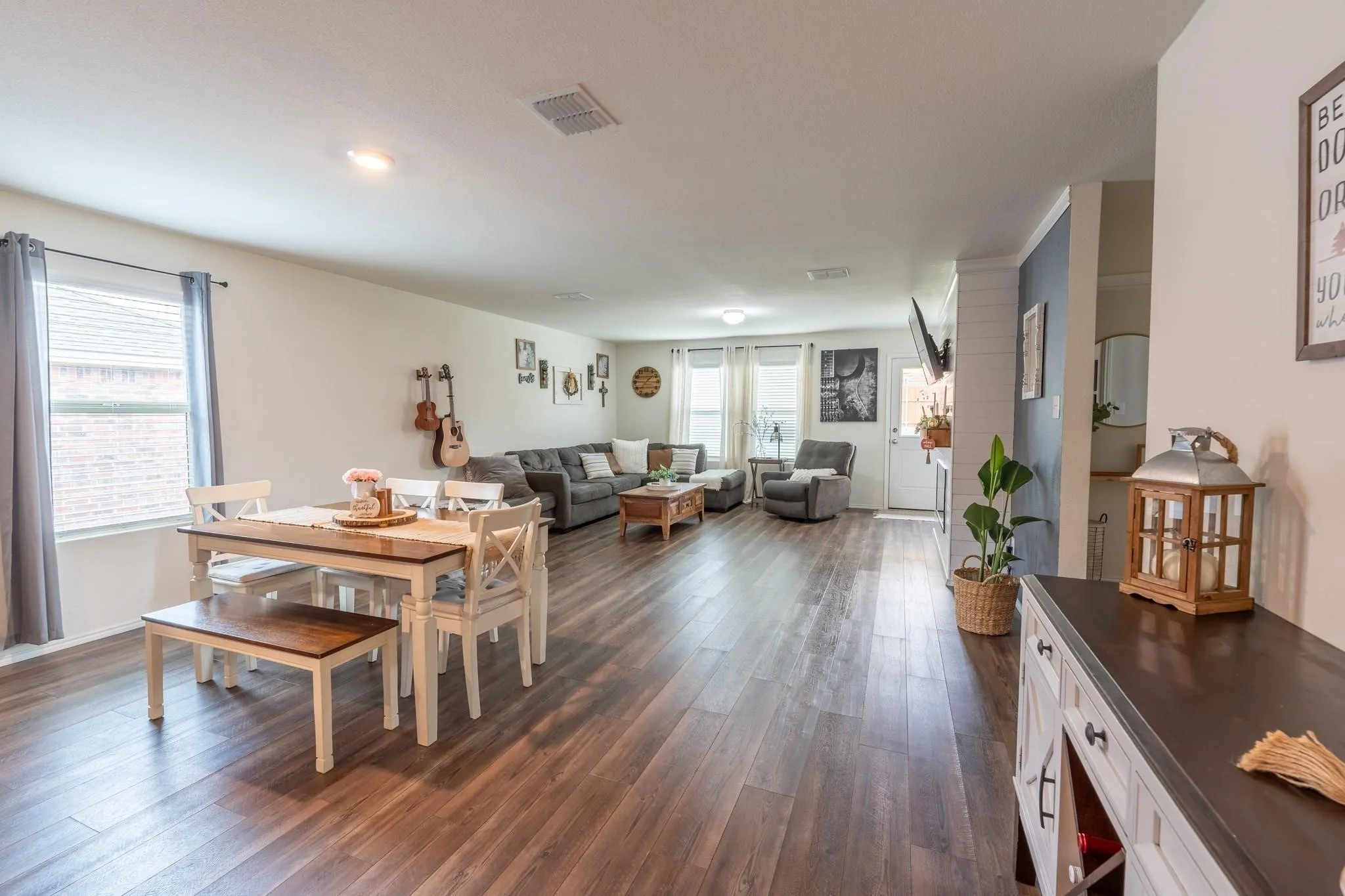 Dining area featuring plenty of natural light and dark hardwood / wood-style floors