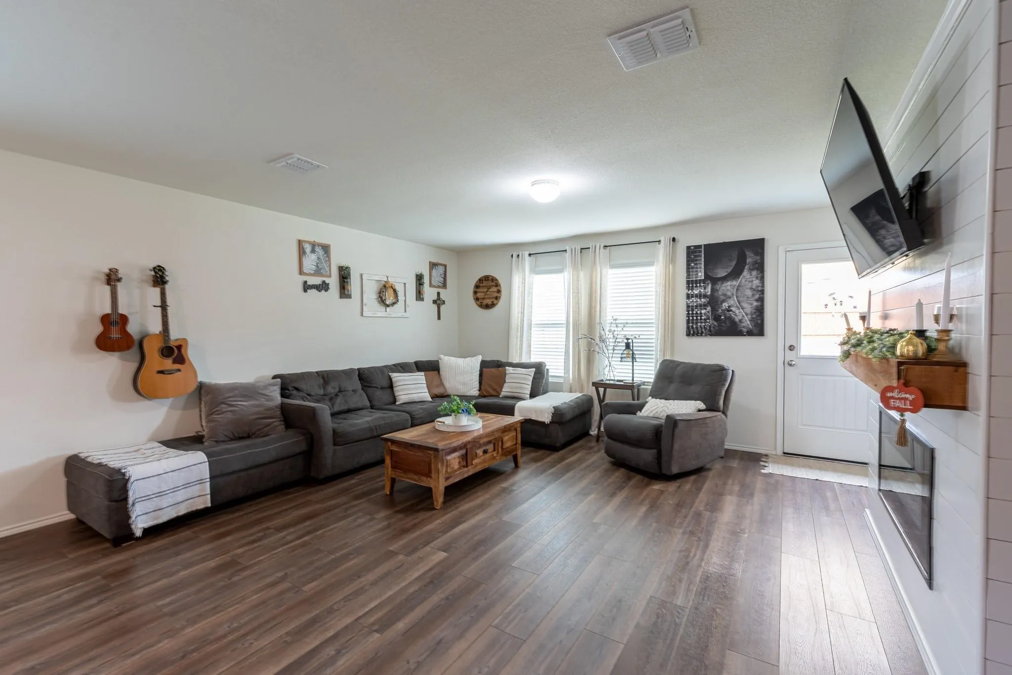 Living room with dark hardwood / wood-style flooring