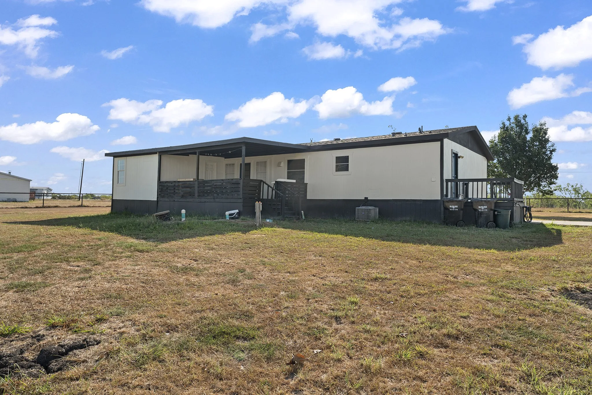 Expansive open yard offering plenty of space for outdoor activities, recreation, gardening, or future improvements.