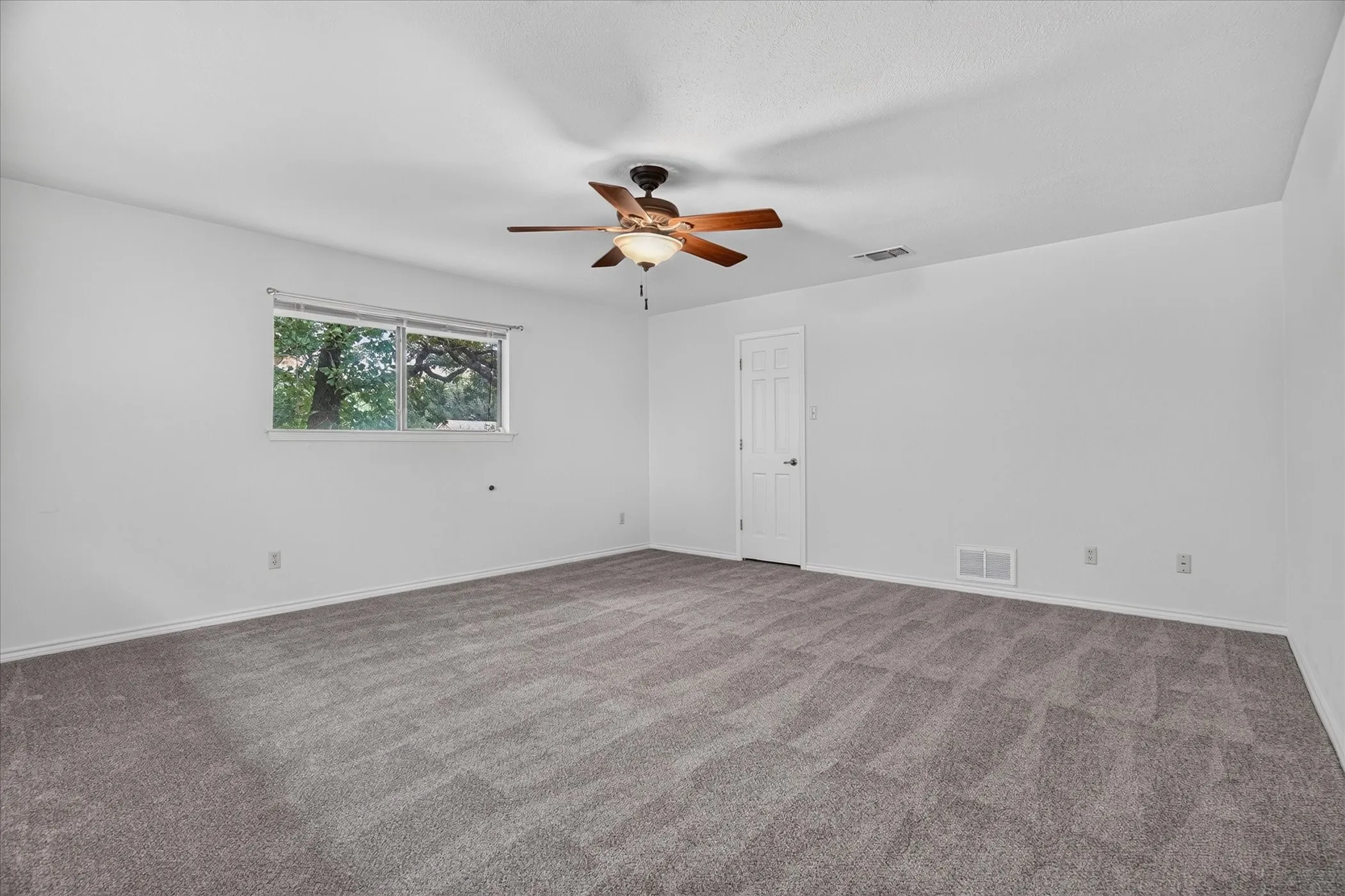 Large upstairs bedroom with a walk in closet