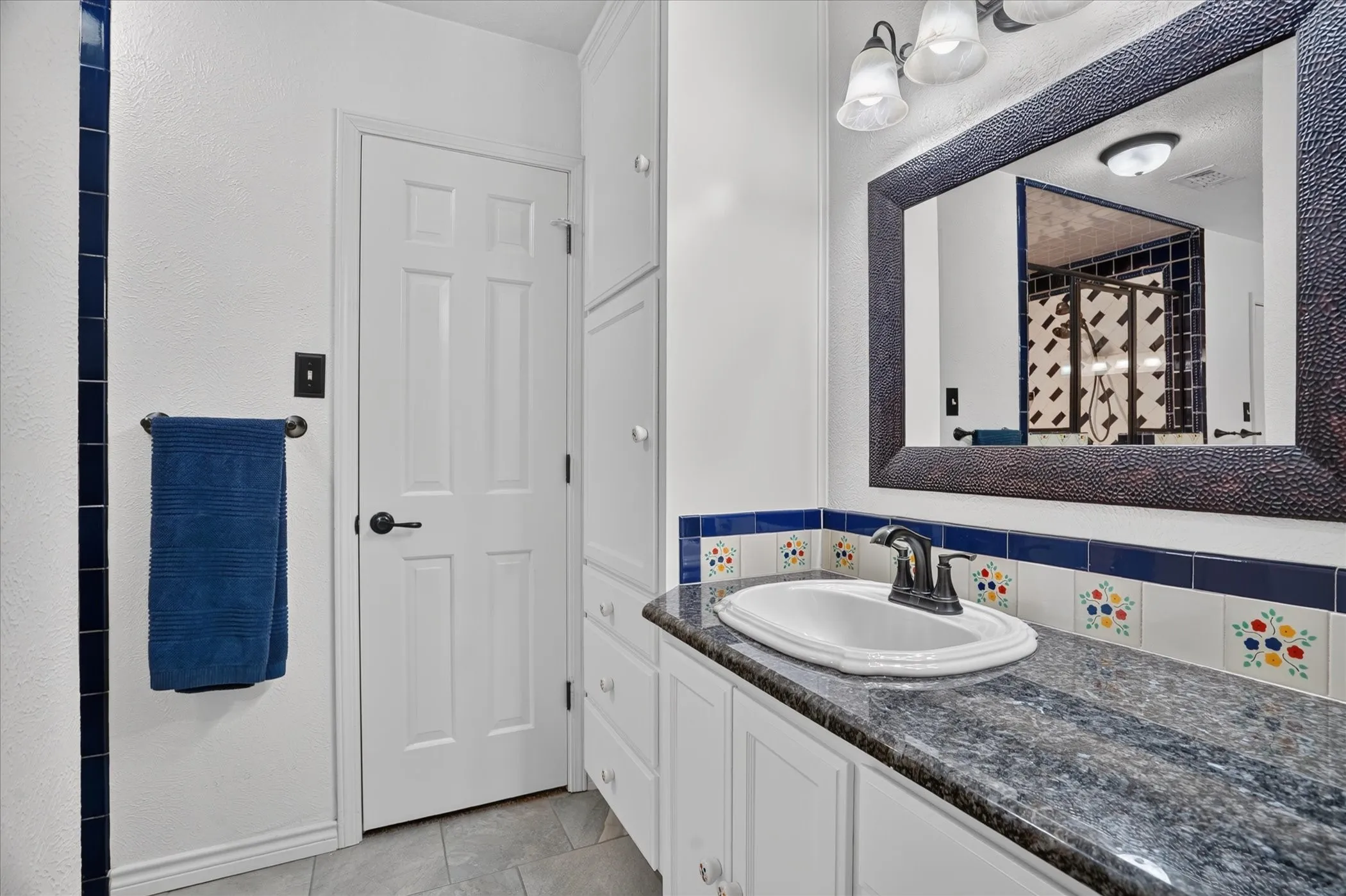 The primary bath has separate sinks/vanities, a huge shower with dual shower heads, and walk in closets.