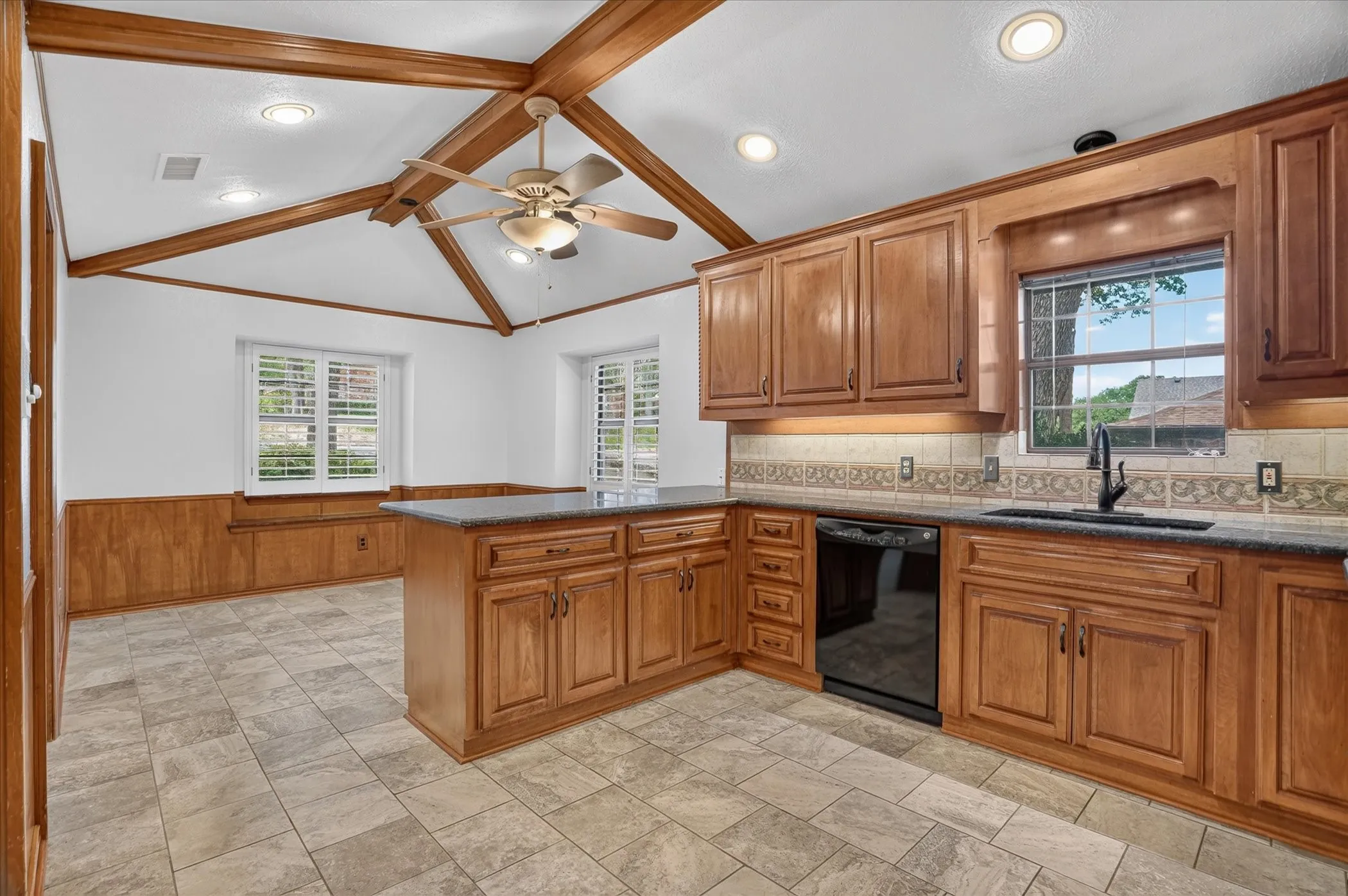 Kitchen featuring granite countertops, double oven, and plenty of space