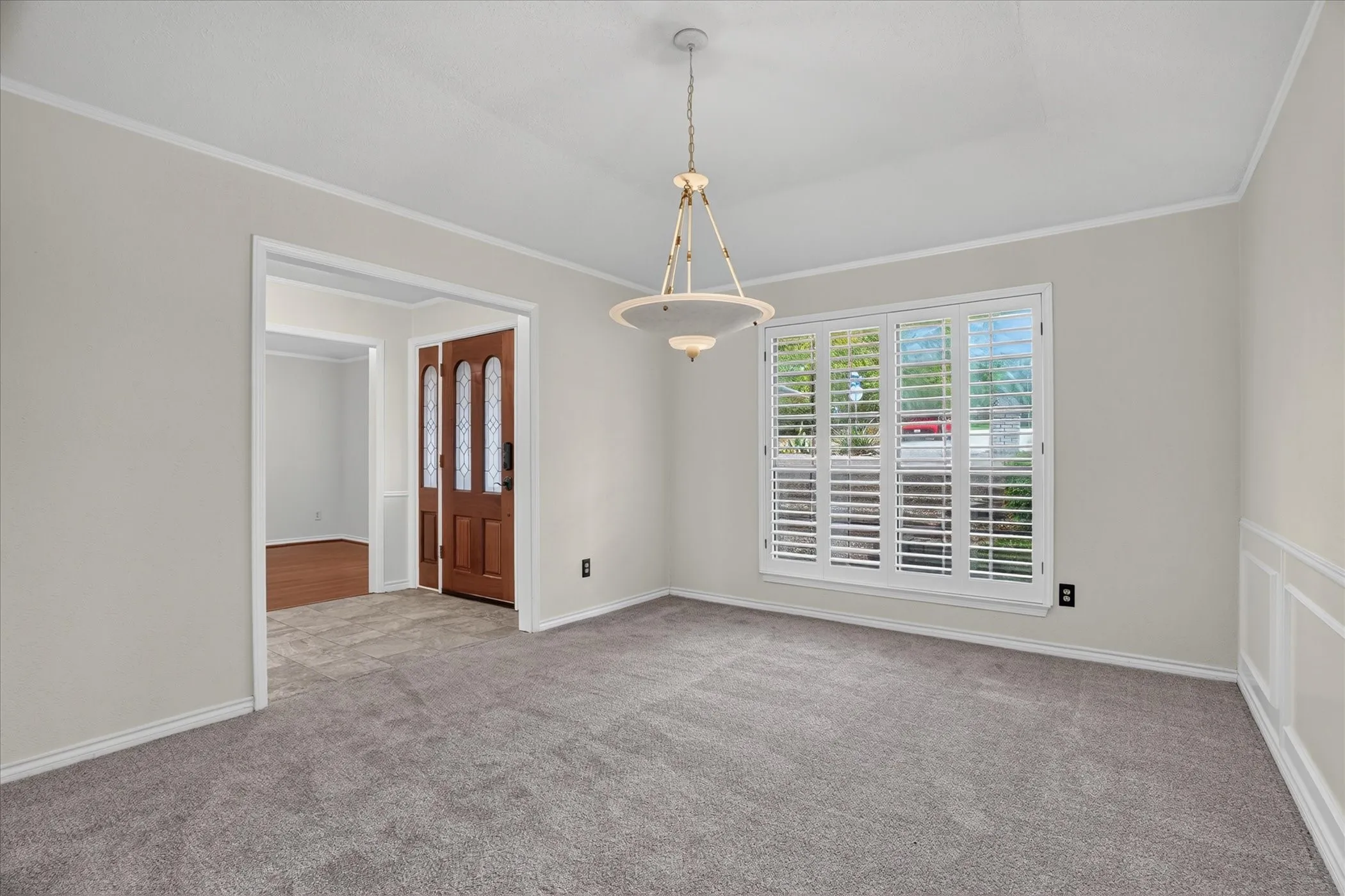 This room off the entryway also leads to the kitchen and can be used as the formal dining room