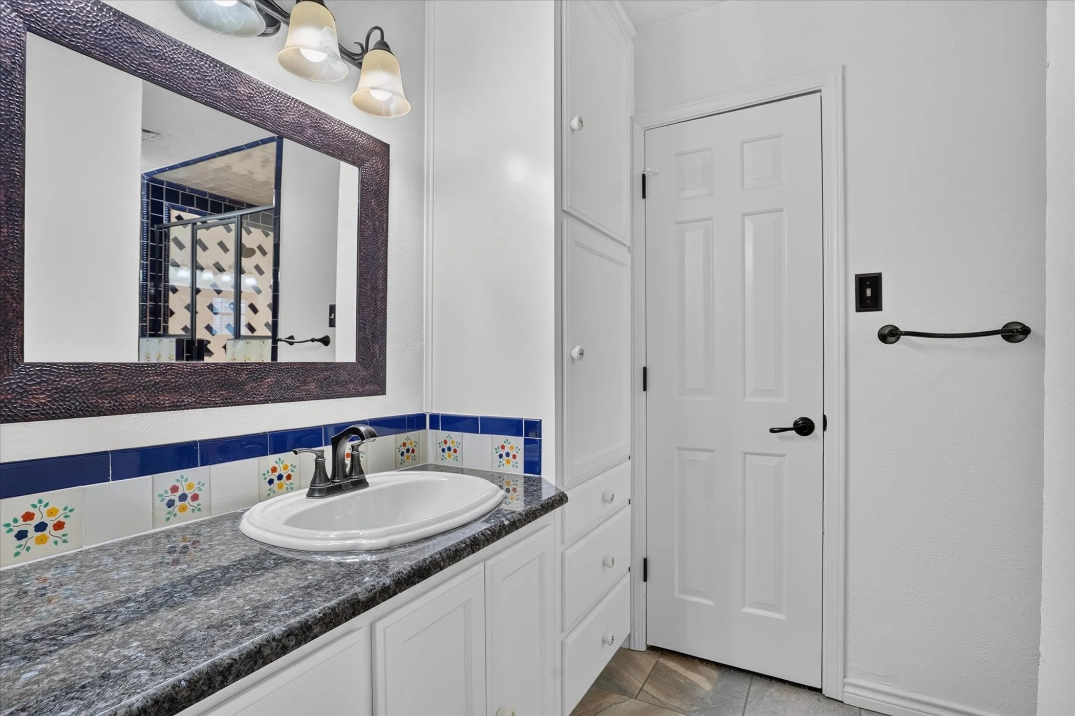 The primary bath has separate sinks/vanities, a huge shower with dual shower heads, and walk in closets.