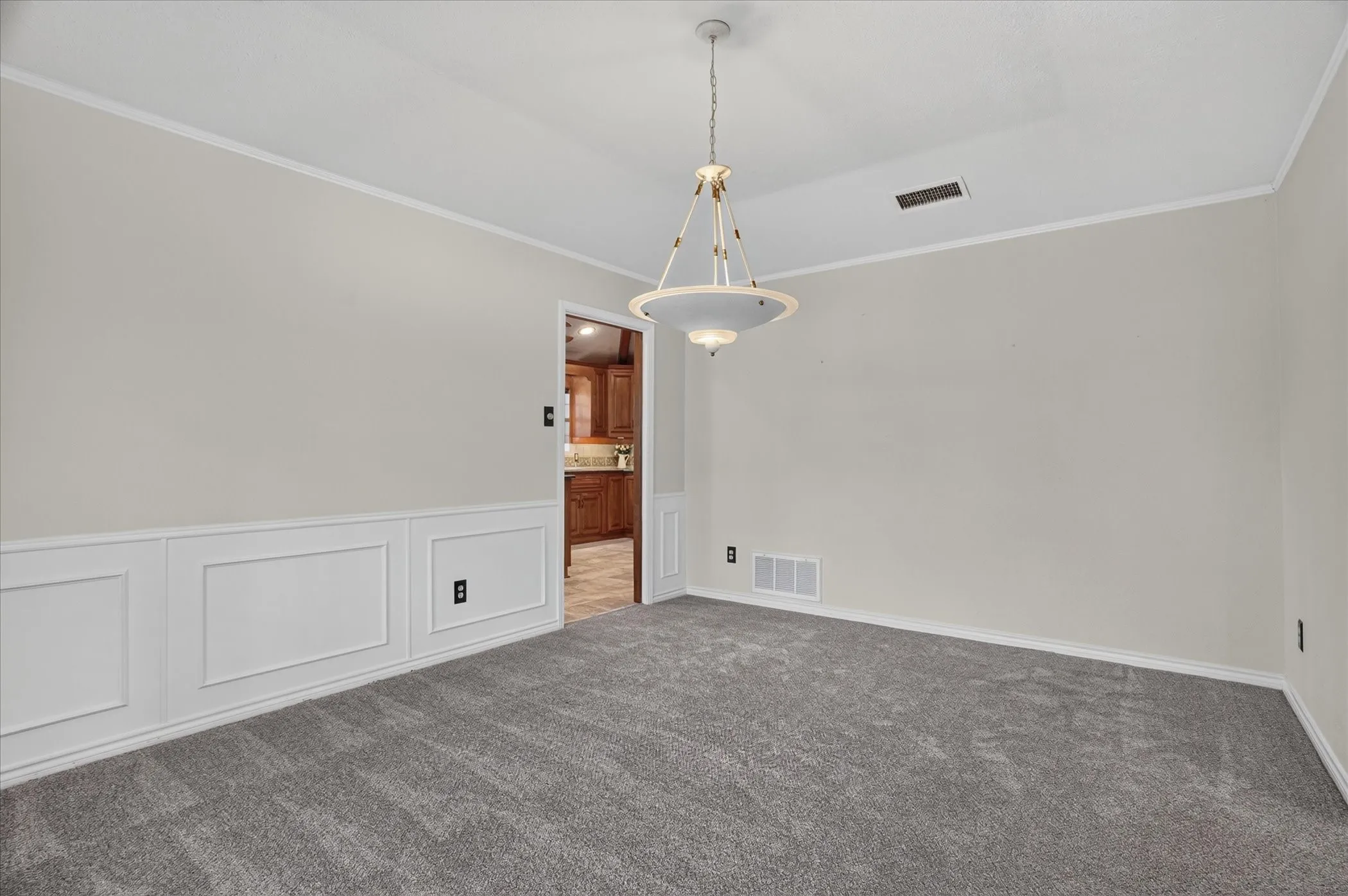 This room off the entryway also leads to the kitchen and can be used as the formal dining room