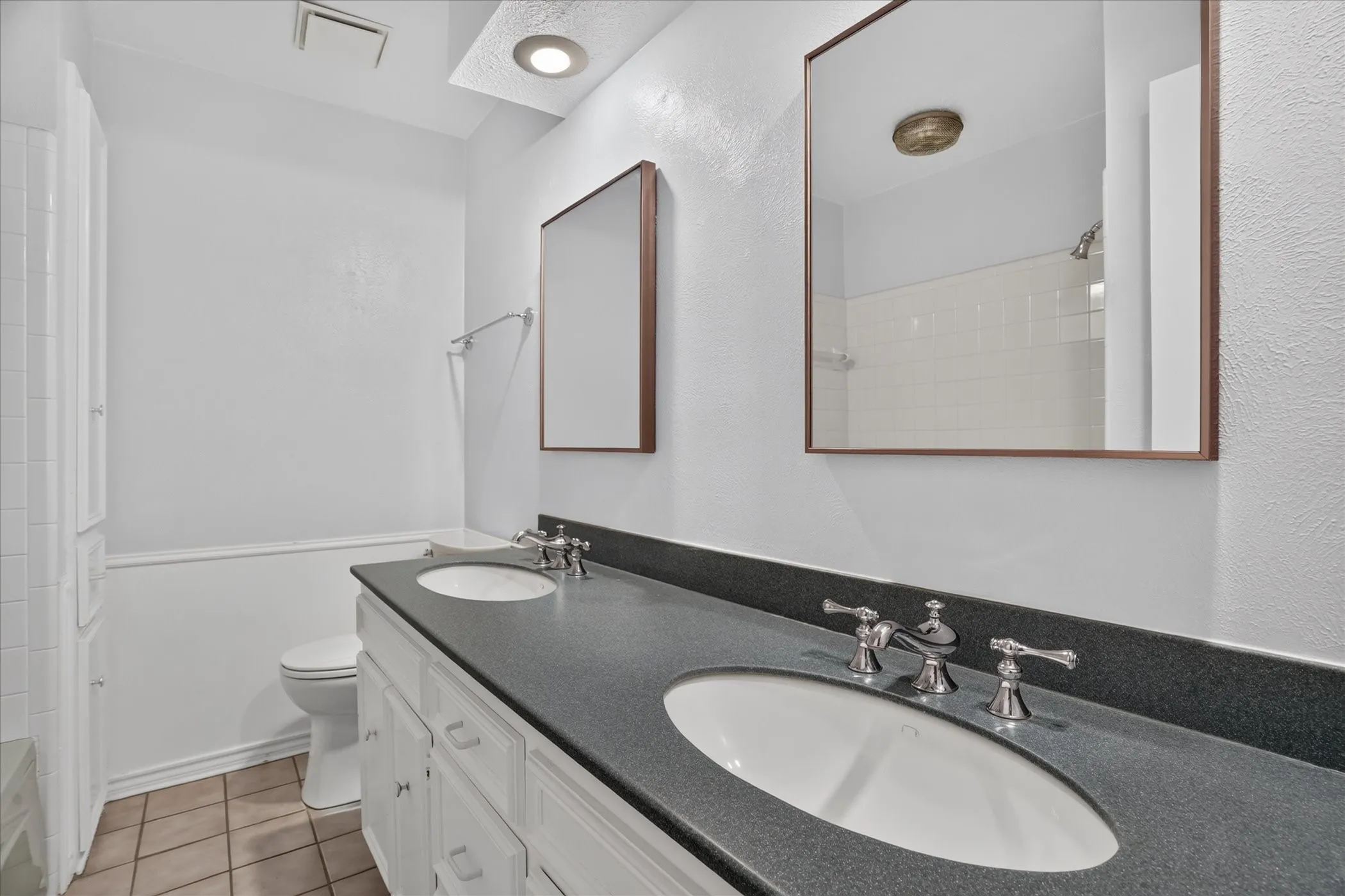Downstairs bathroom with two sinks