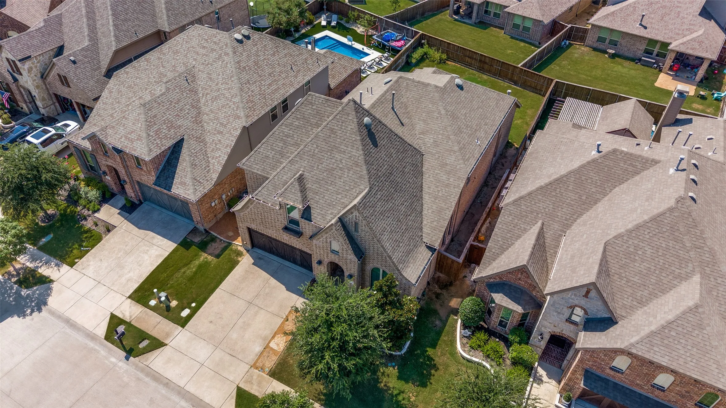 Property featuring a multi-gabled roofline and brick facade