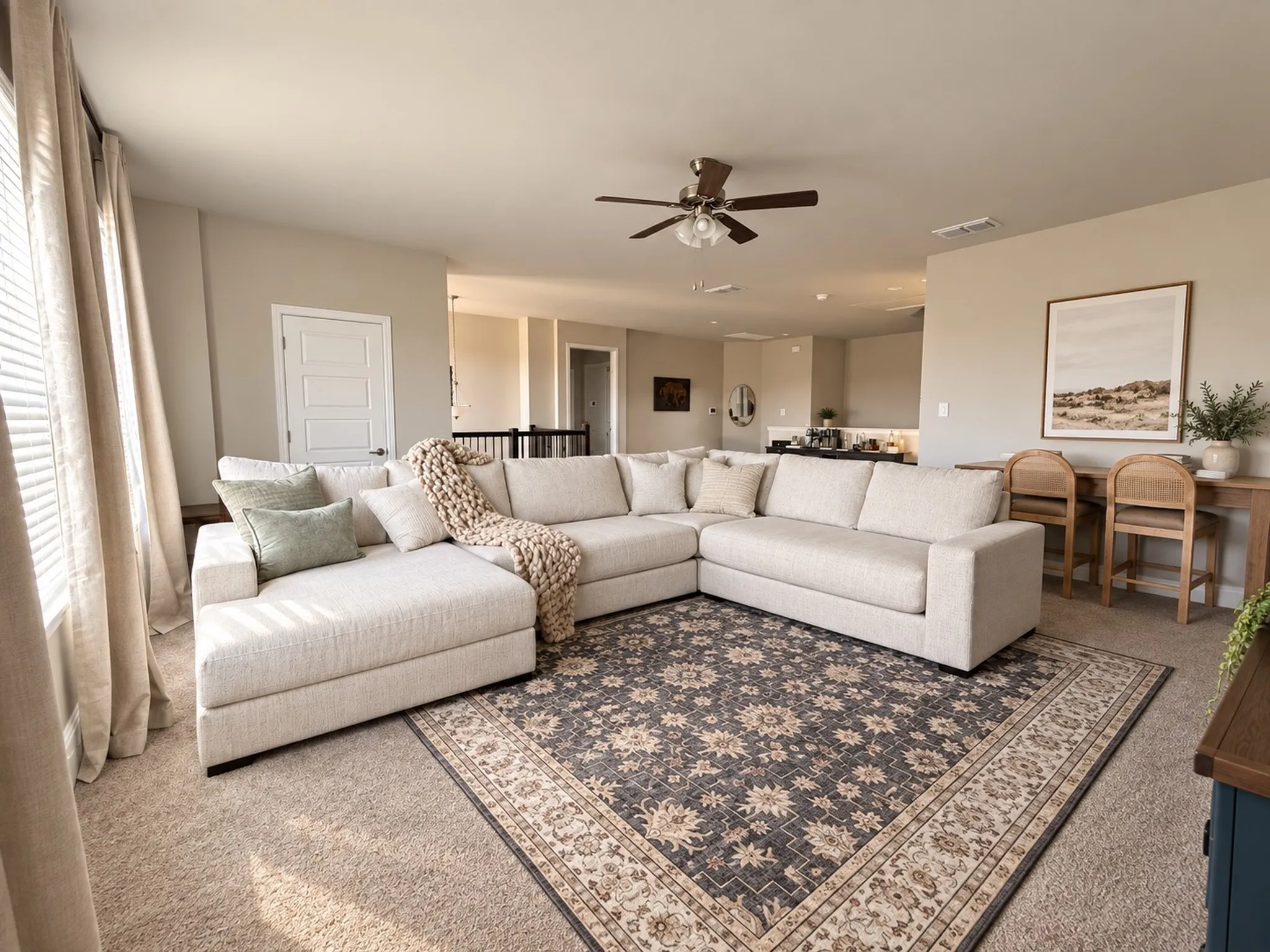 Neutral-toned walls complement the carpeted flooring throughout the space