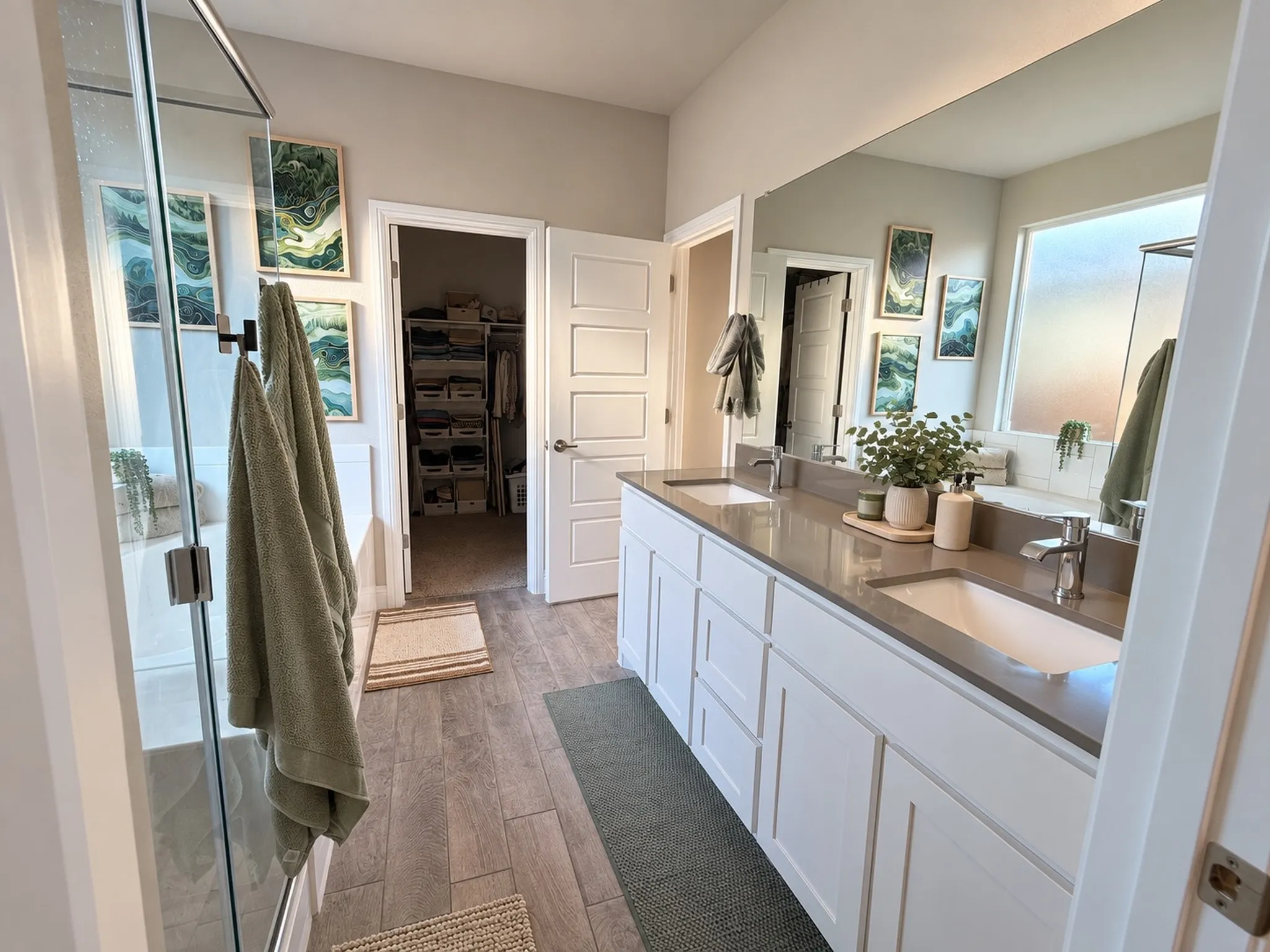 Dual white cabinet vanity with integrated sinks and gray countertops