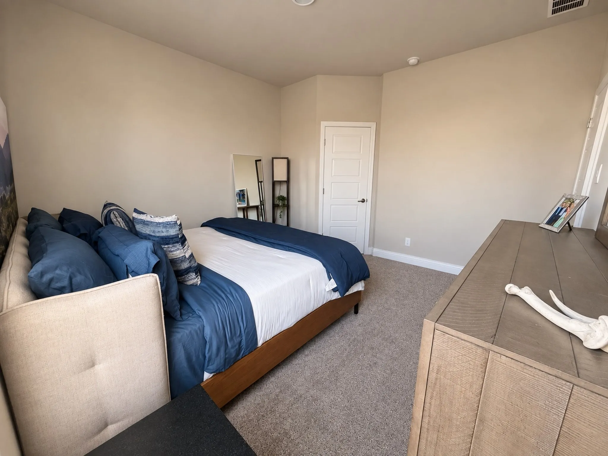 Carpeted flooring with painted baseboards
