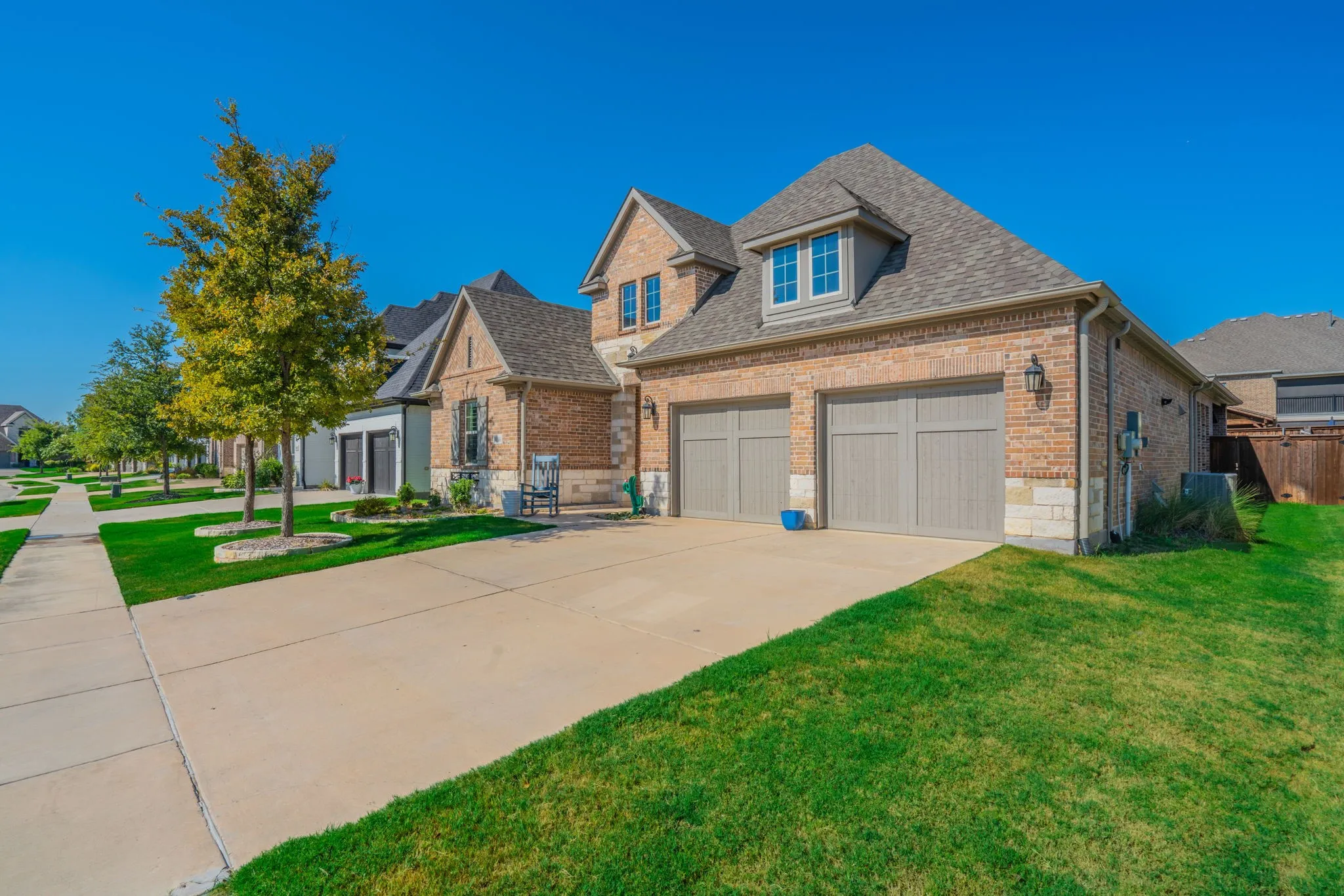 Brick exterior with stone accents and a gabled roof